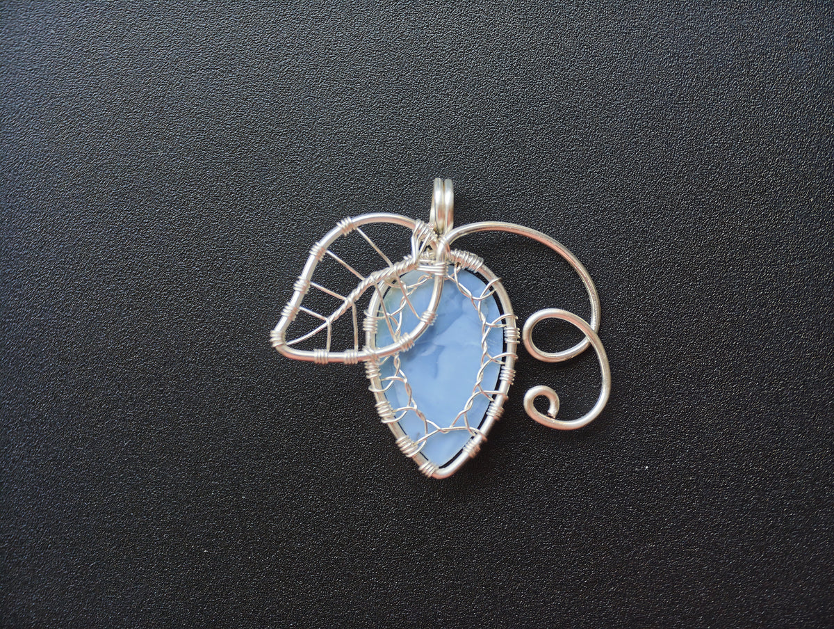 Leaf pendant with a blue opal gemstone