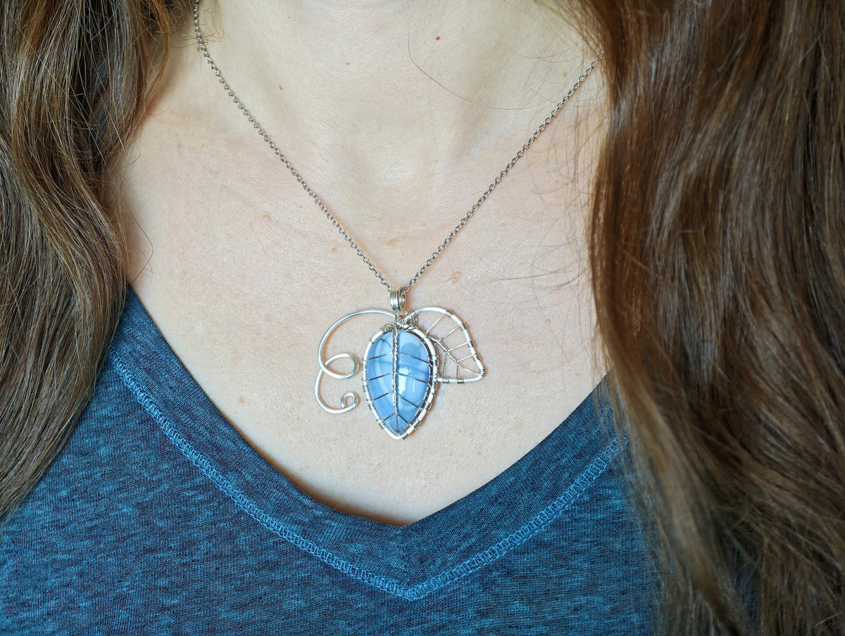 Leaf pendant with a blue opal gemstone