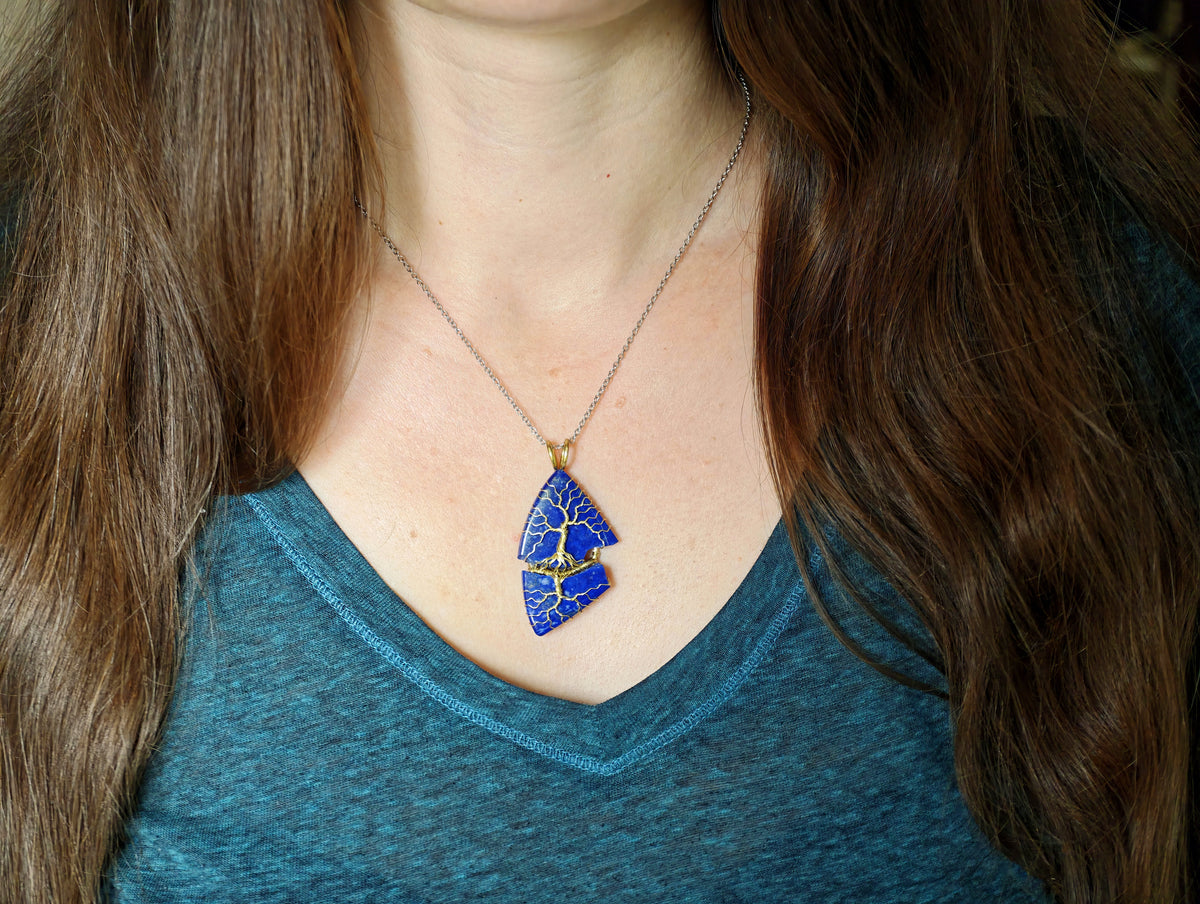 Tree pendant with a broken lapis lazuli gemstone