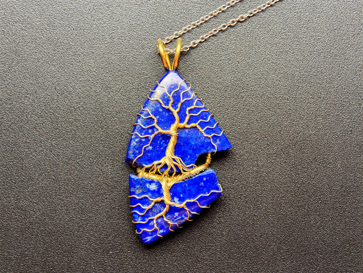 Tree pendant with a broken lapis lazuli gemstone