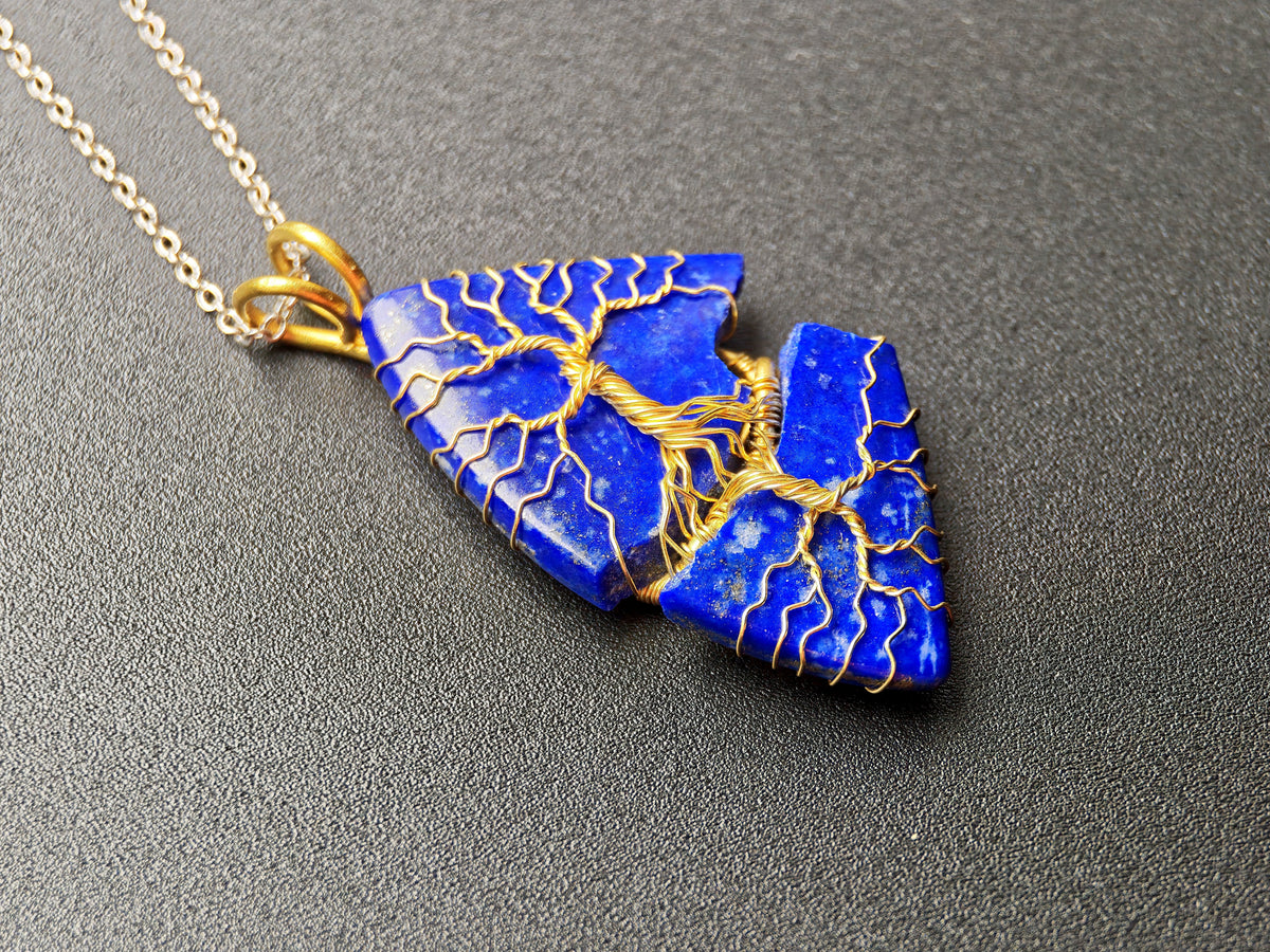 Tree pendant with a broken lapis lazuli gemstone
