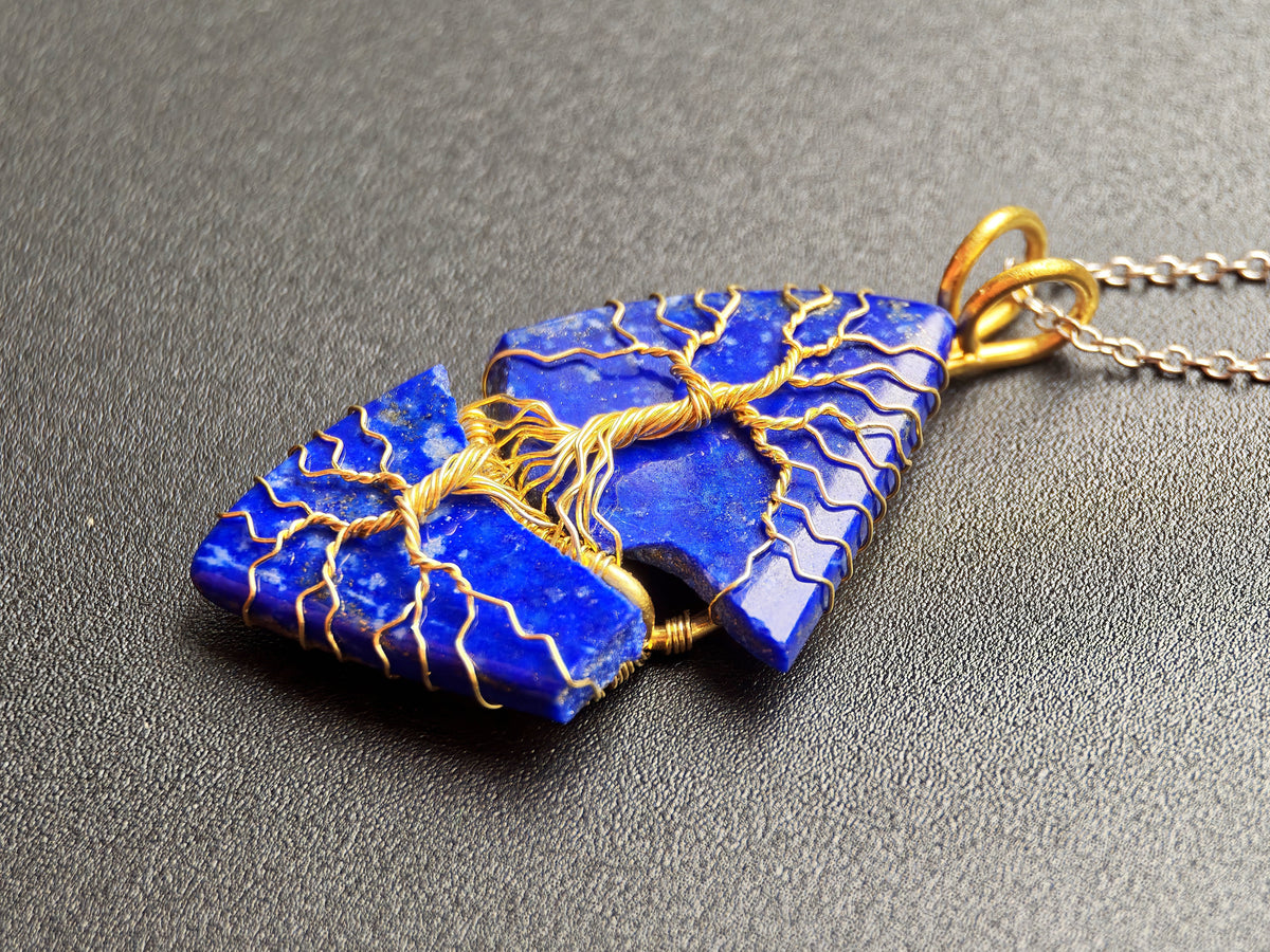 Tree pendant with a broken lapis lazuli gemstone