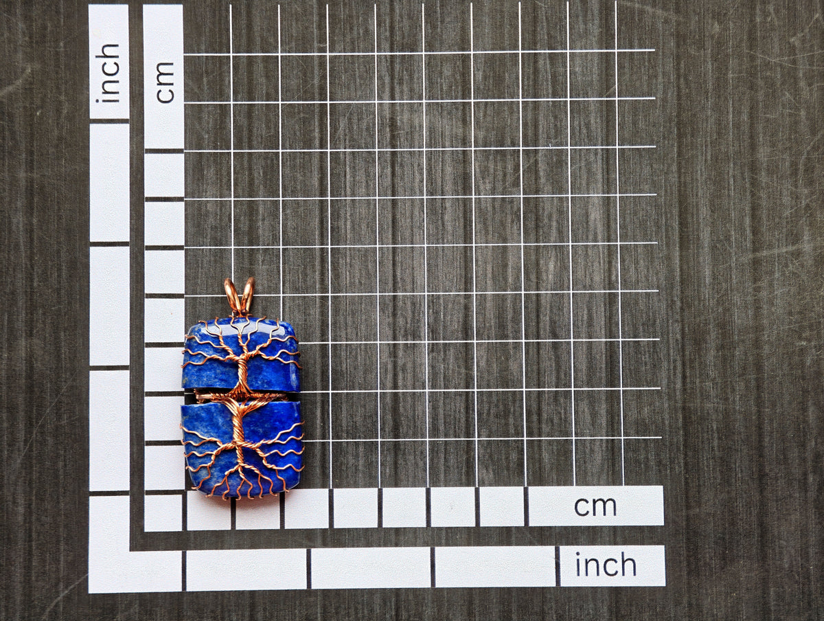 Tree pendant with a broken lapis lazuli gemstone