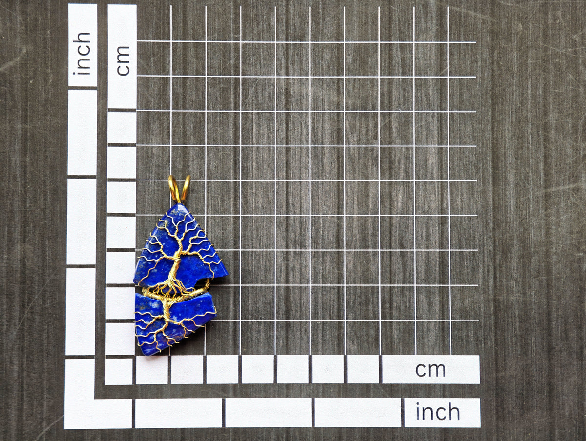 Tree pendant with a broken lapis lazuli gemstone