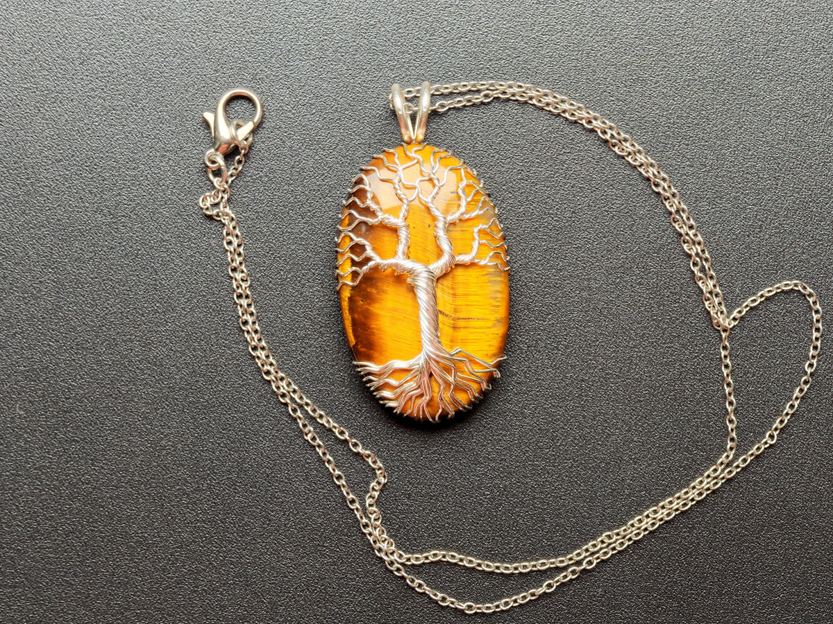 Tree pendant with a tiger's eye gemstone