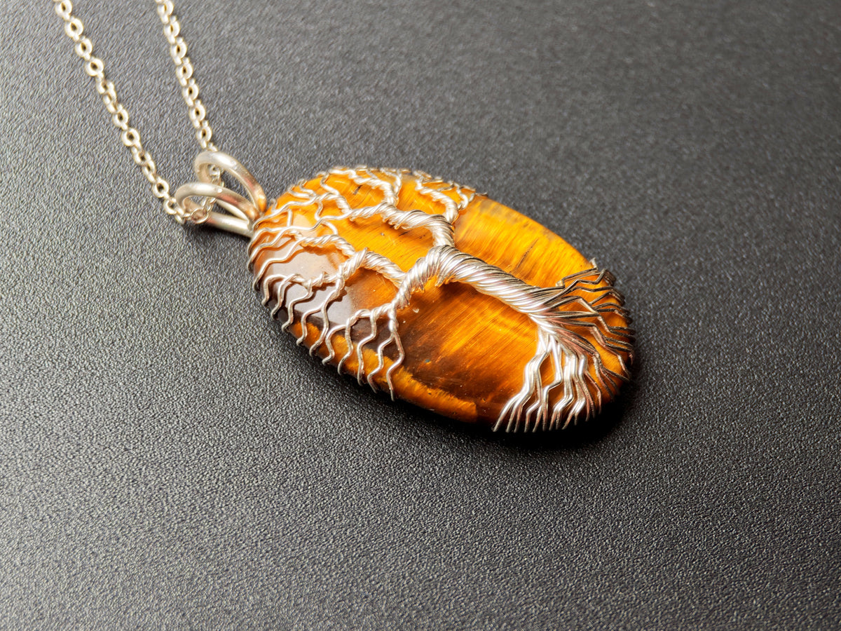Tree pendant with a tiger's eye gemstone