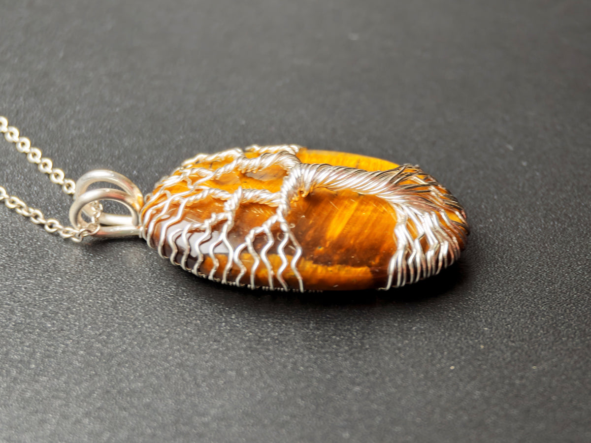 Tree pendant with a tiger's eye gemstone