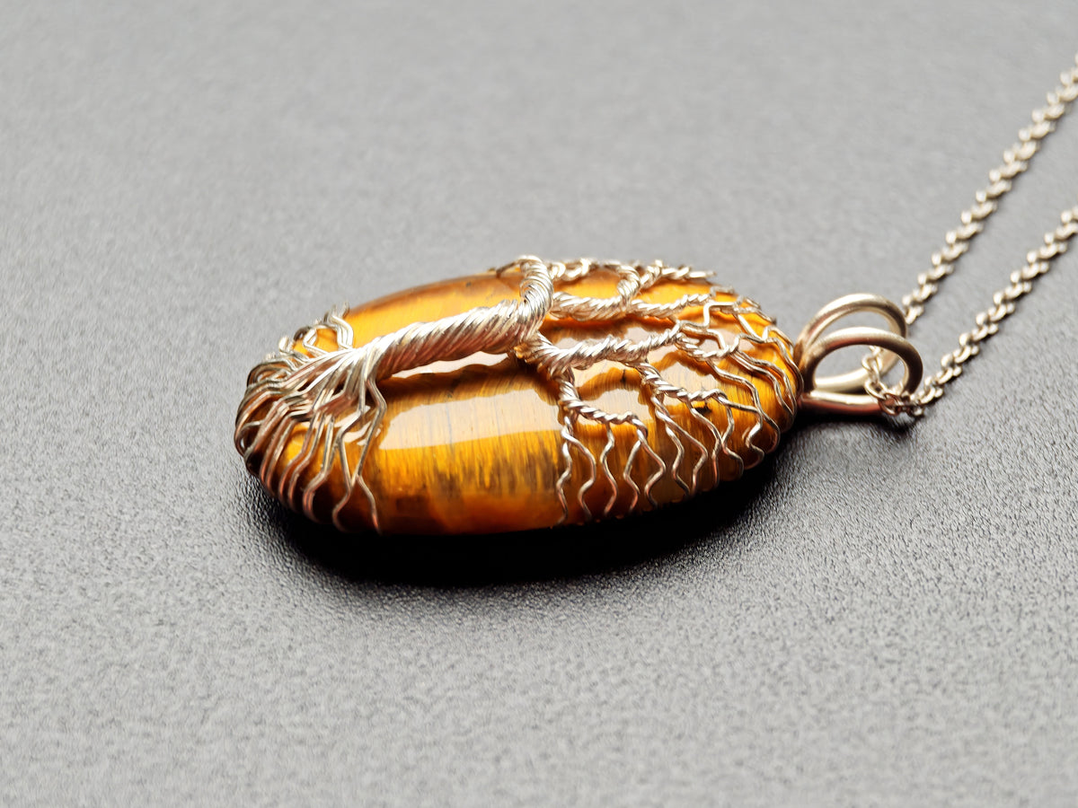 Tree pendant with a tiger's eye gemstone