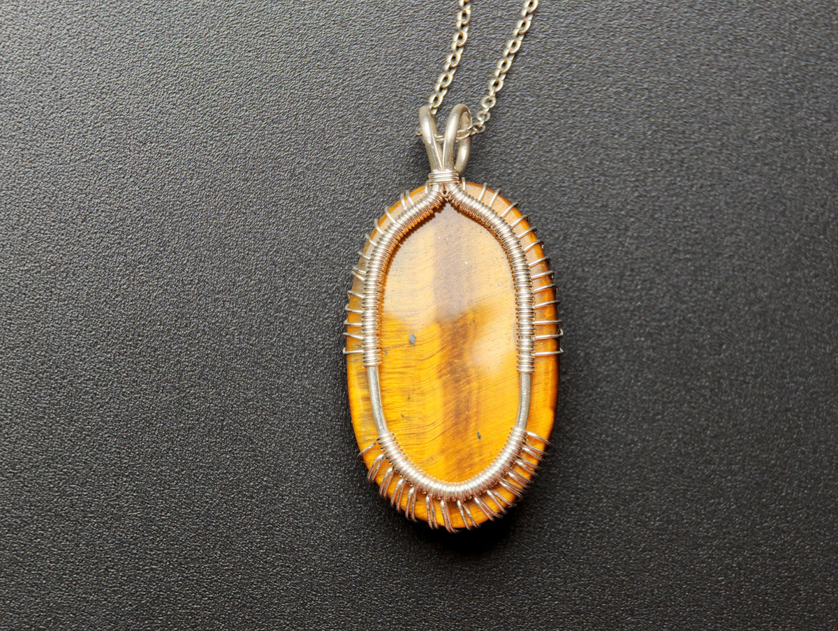 Tree pendant with a tiger's eye gemstone
