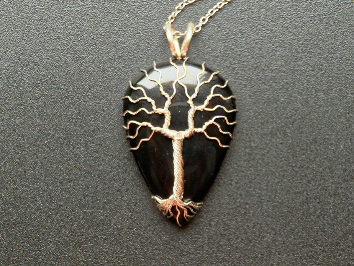Tree pendant with a black onyx gemstone