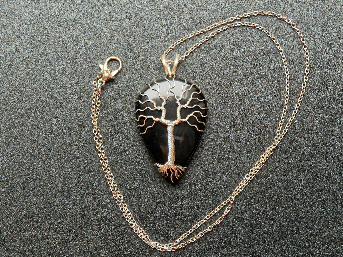 Tree pendant with a black onyx gemstone