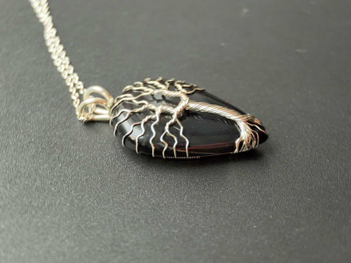Tree pendant with a black onyx gemstone