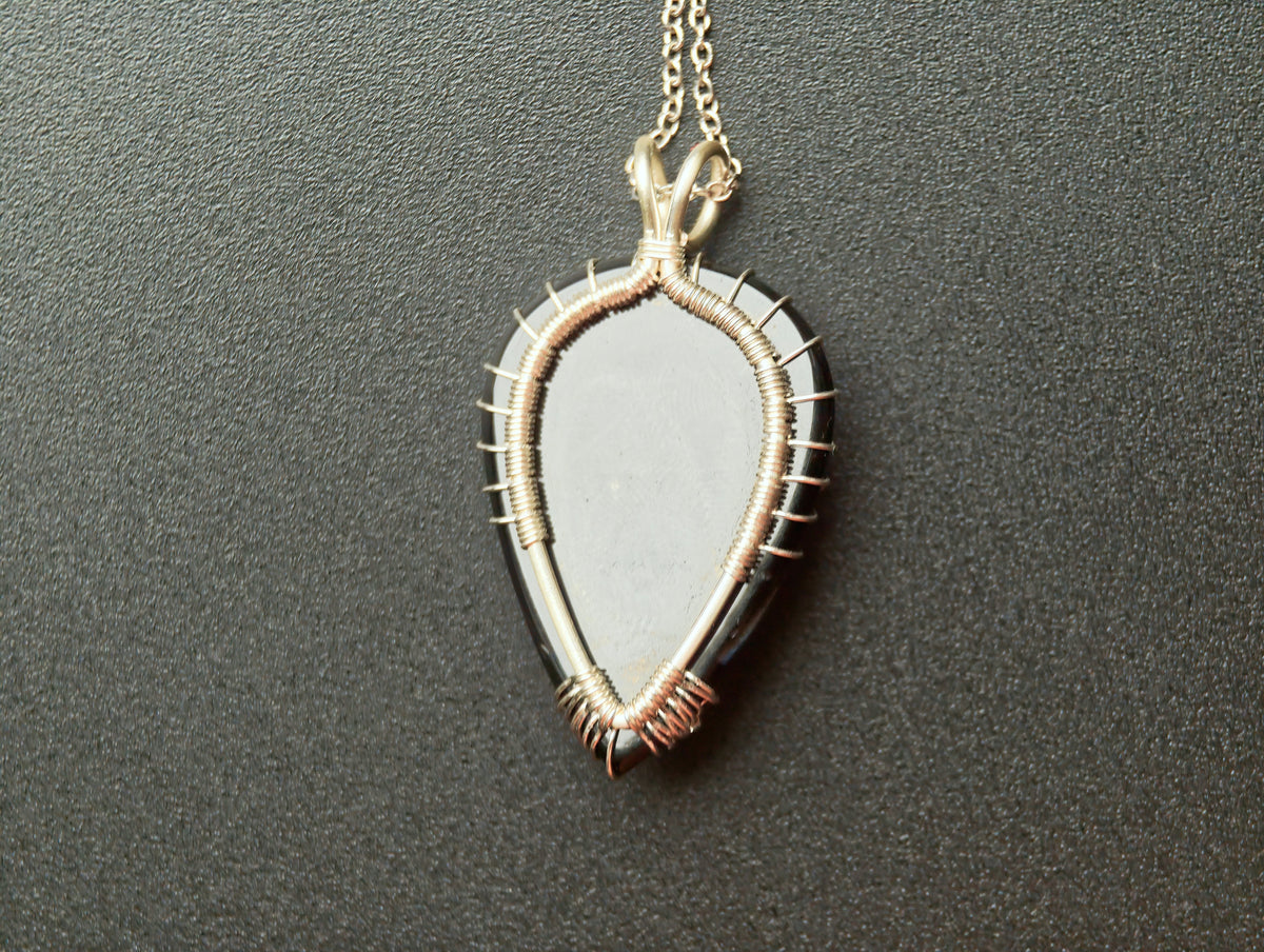 Tree pendant with a black onyx gemstone