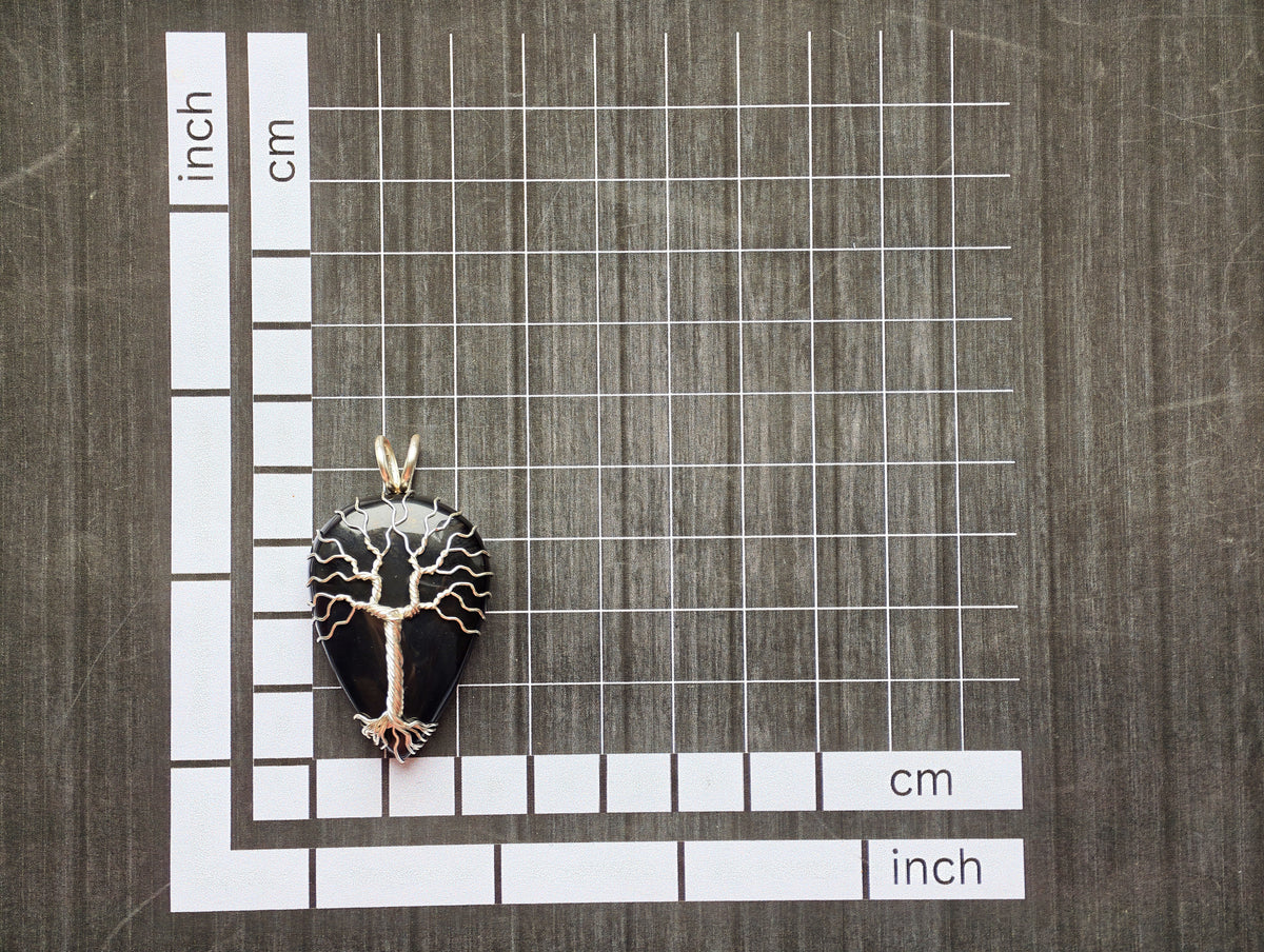 Tree pendant with a black onyx gemstone