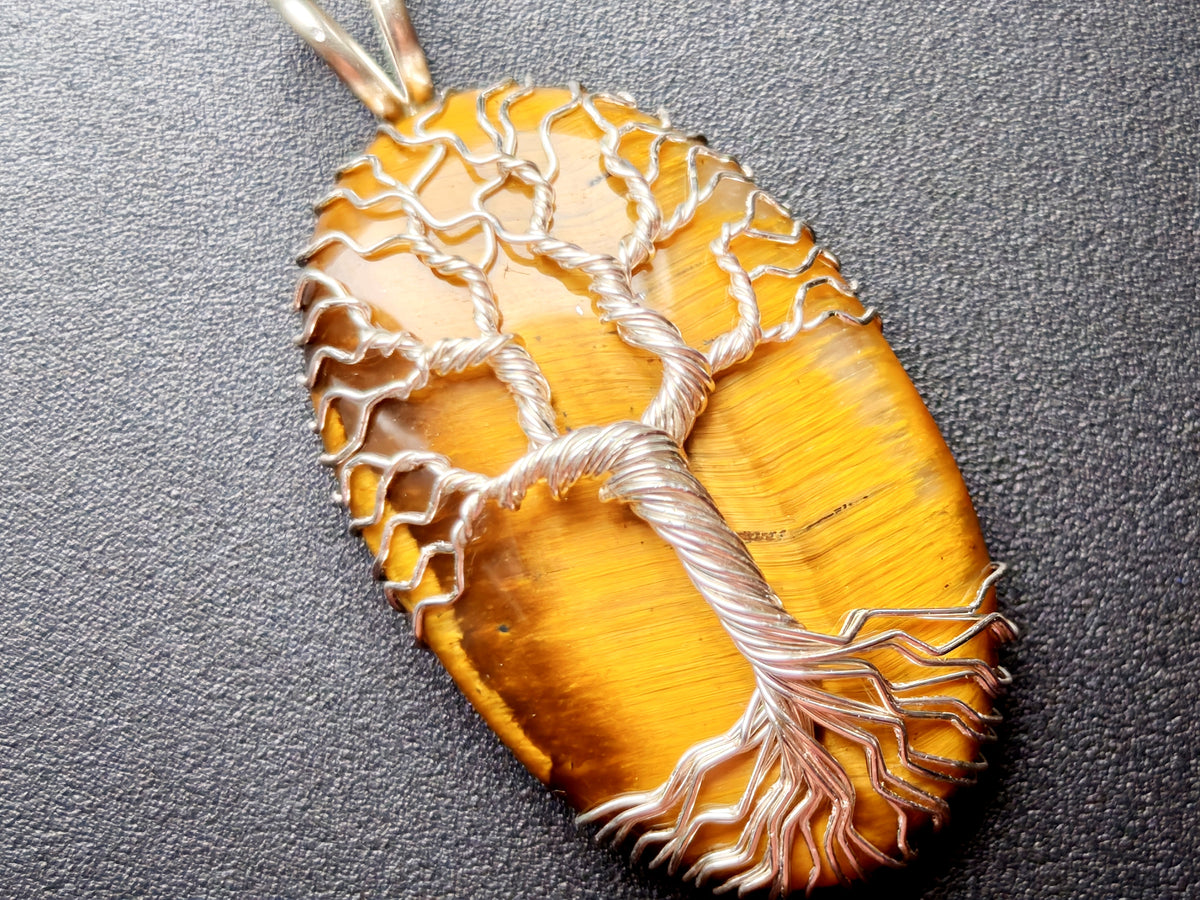 Tree pendant with a tiger's eye gemstone