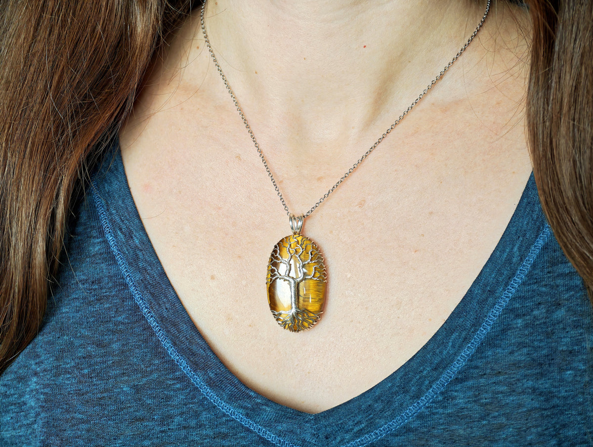 Tree pendant with a tiger's eye gemstone