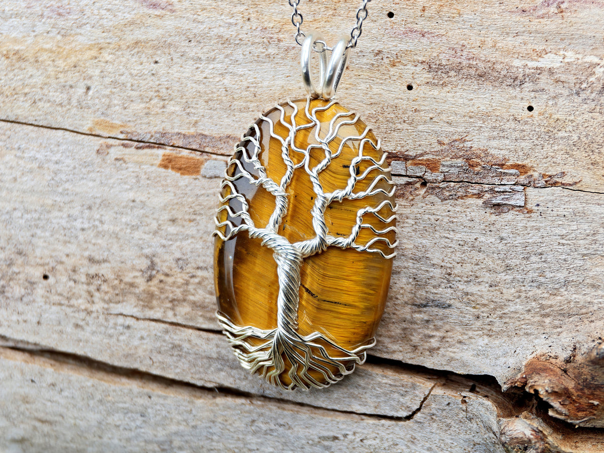 Tree pendant with a tiger's eye gemstone