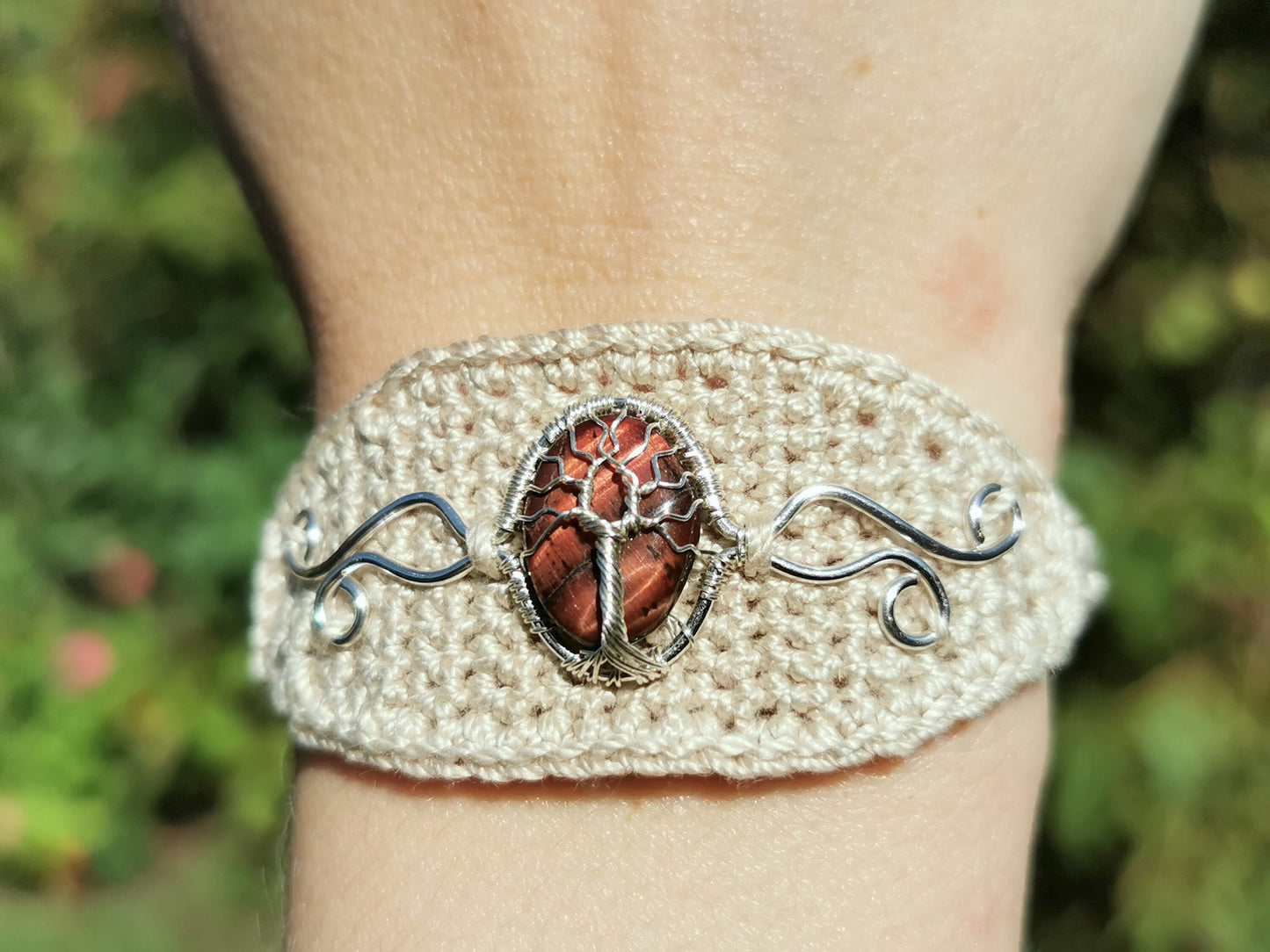 Crochet tree bracelet with a red tiger's eye gemstone