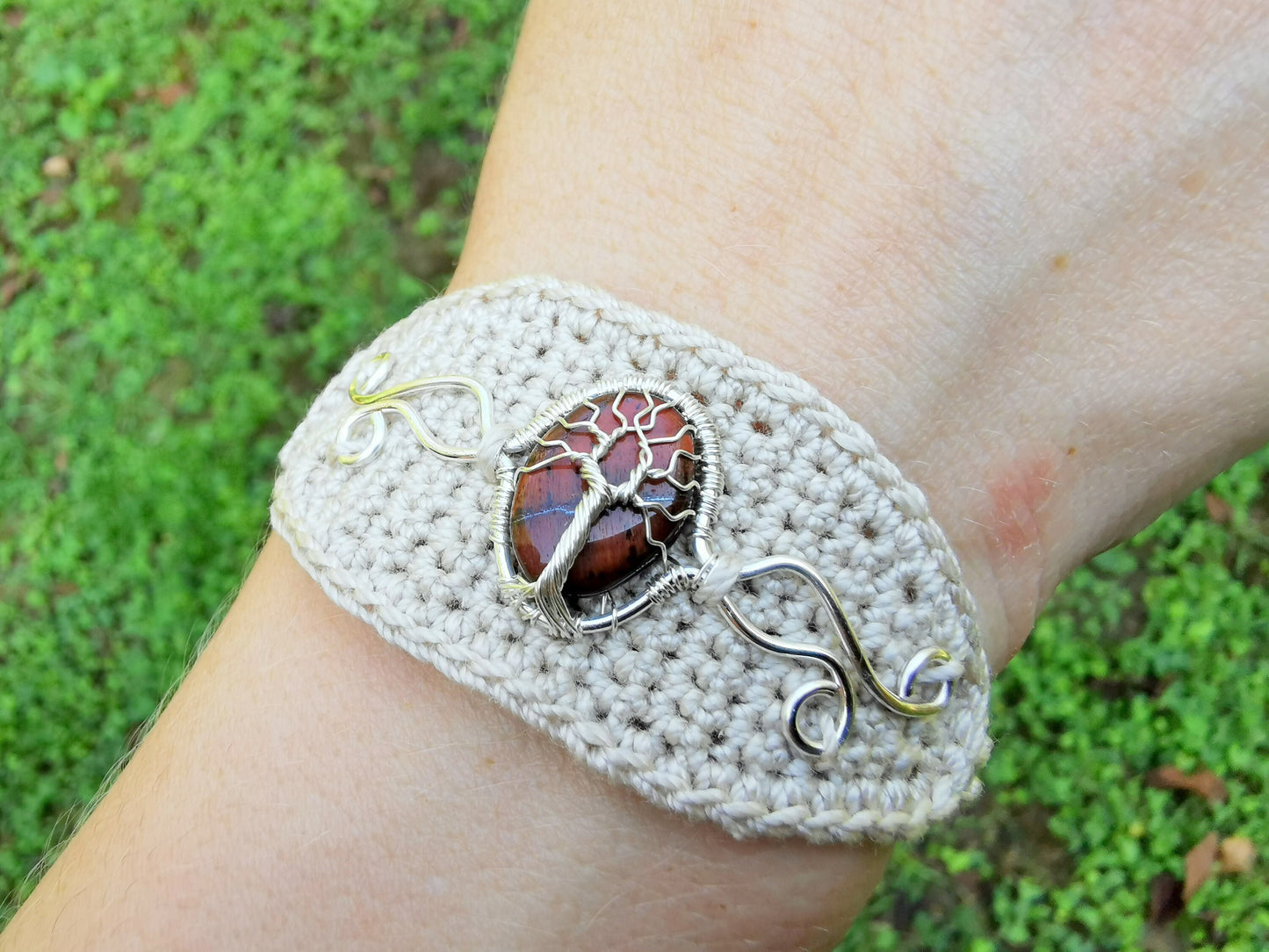 Crochet tree bracelet with a red tiger's eye gemstone