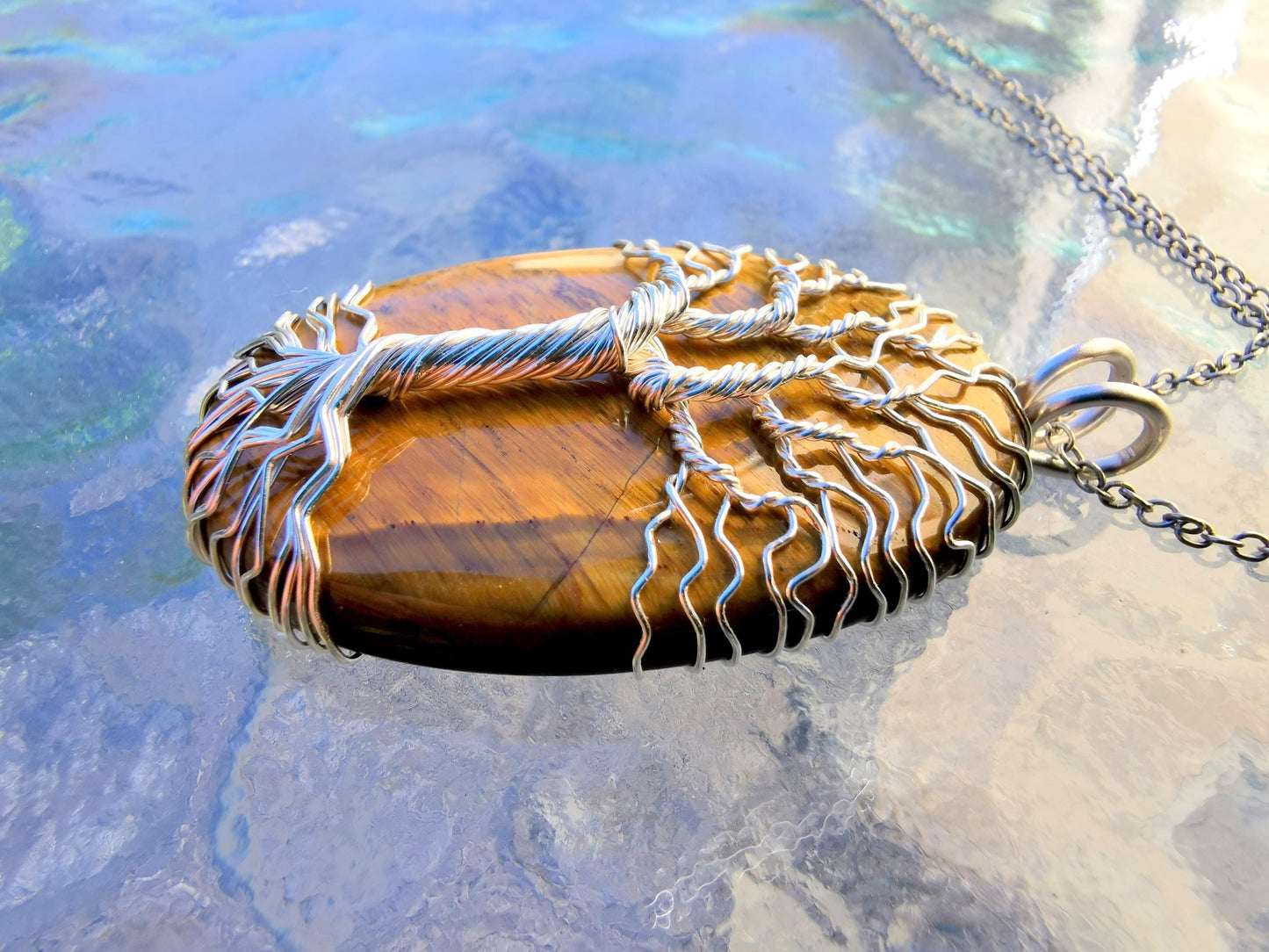 Tree pendant with a tiger's eye gemstone