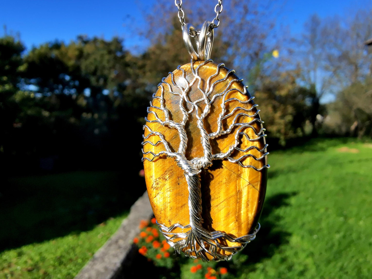 Tree pendant with a tiger's eye gemstone