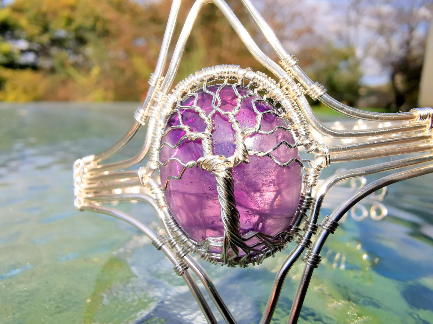 Tree arm ring with an amethyst gemstone