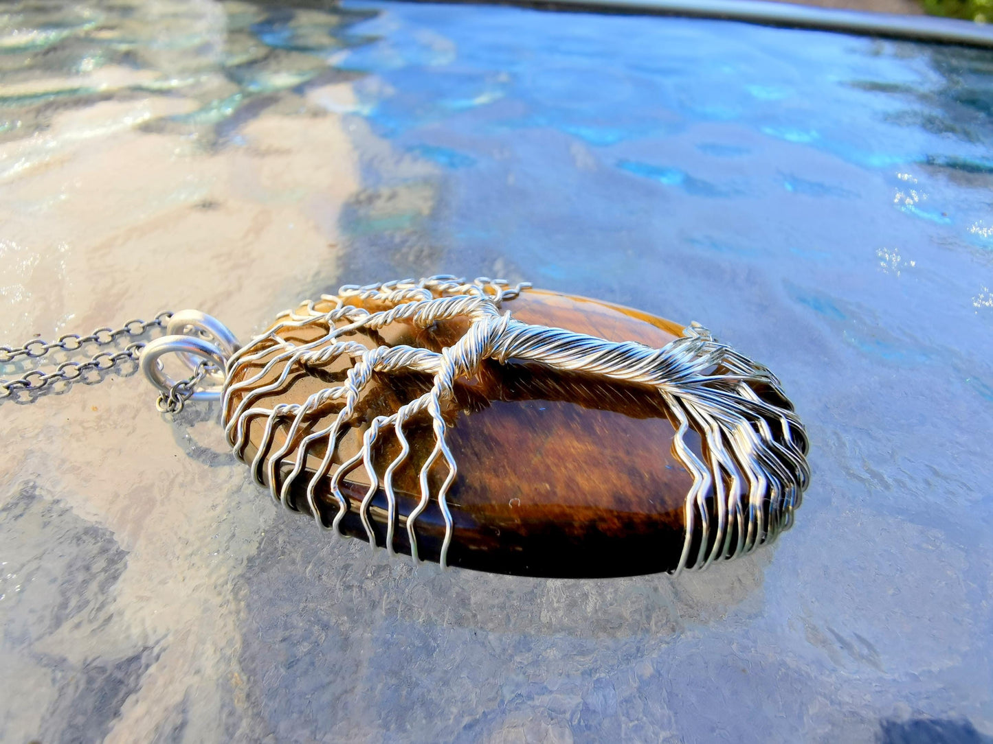 Tree pendant with a tiger's eye gemstone