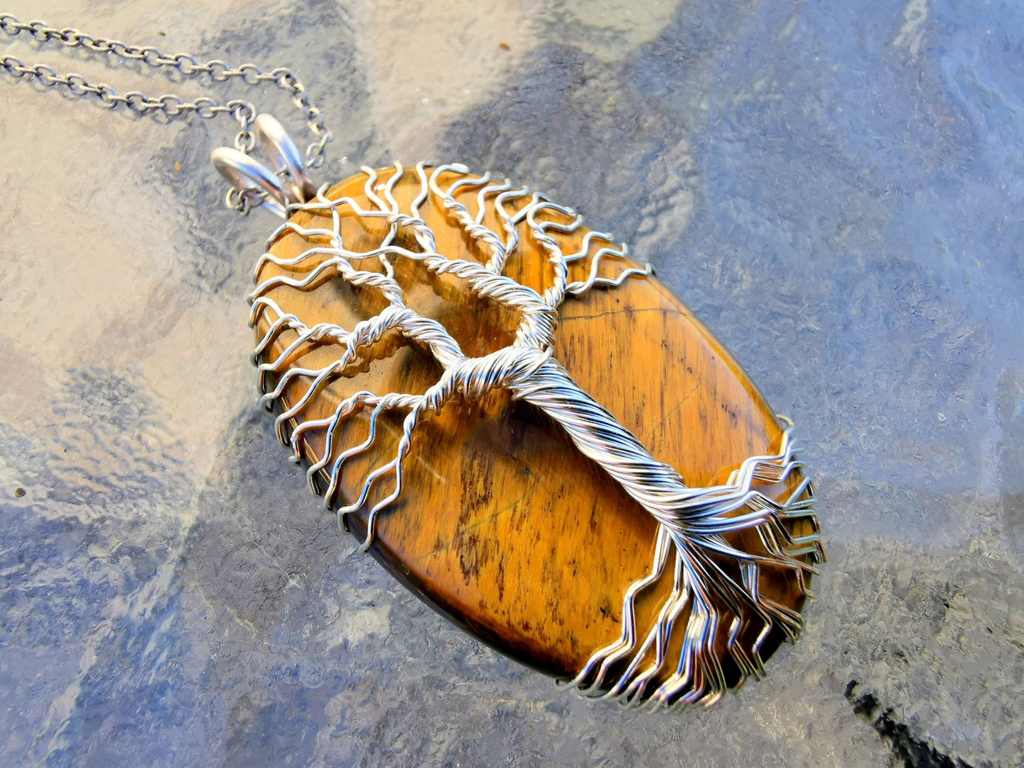 Tree pendant with a tiger's eye gemstone