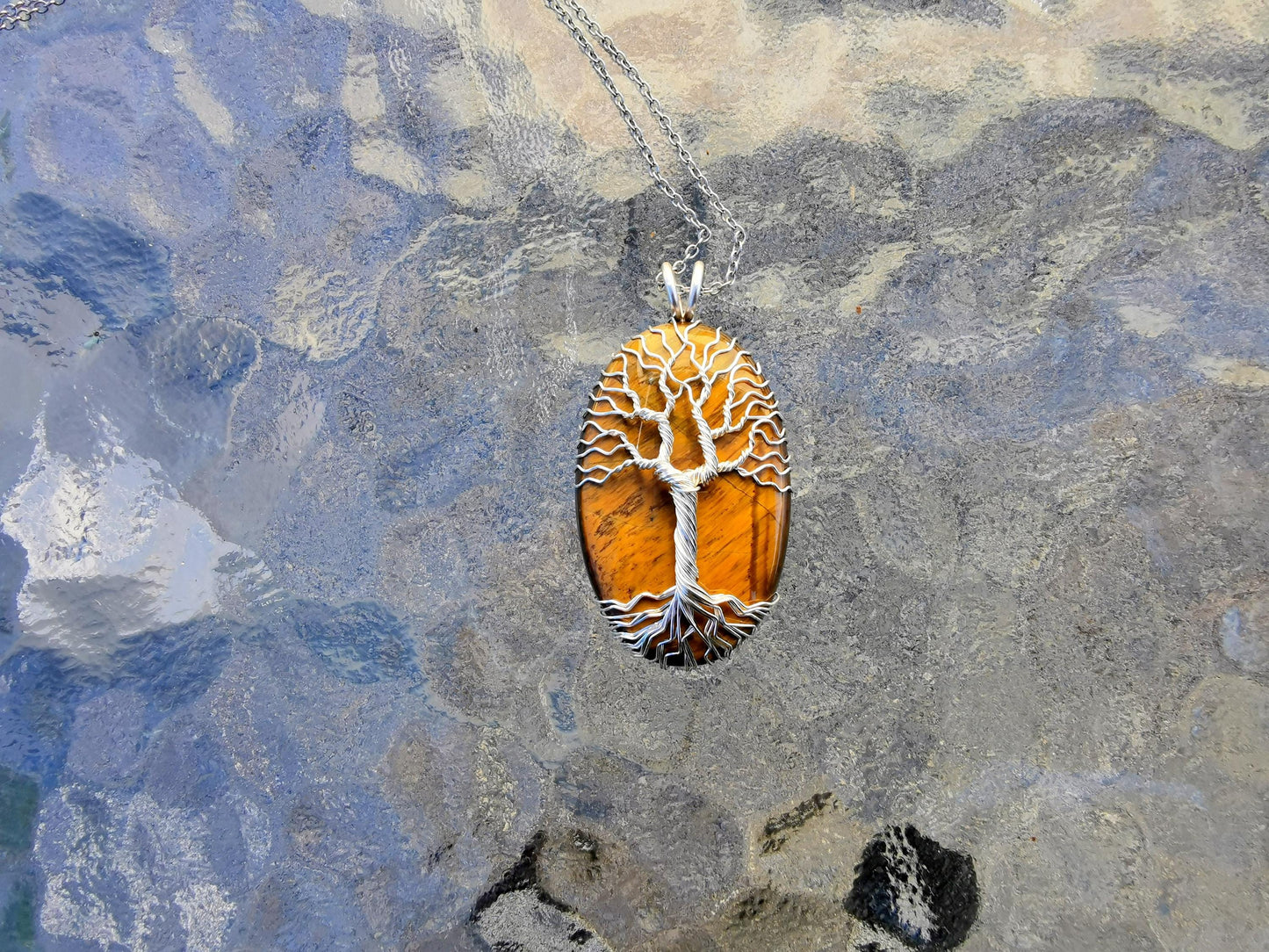 Tree pendant with a tiger's eye gemstone