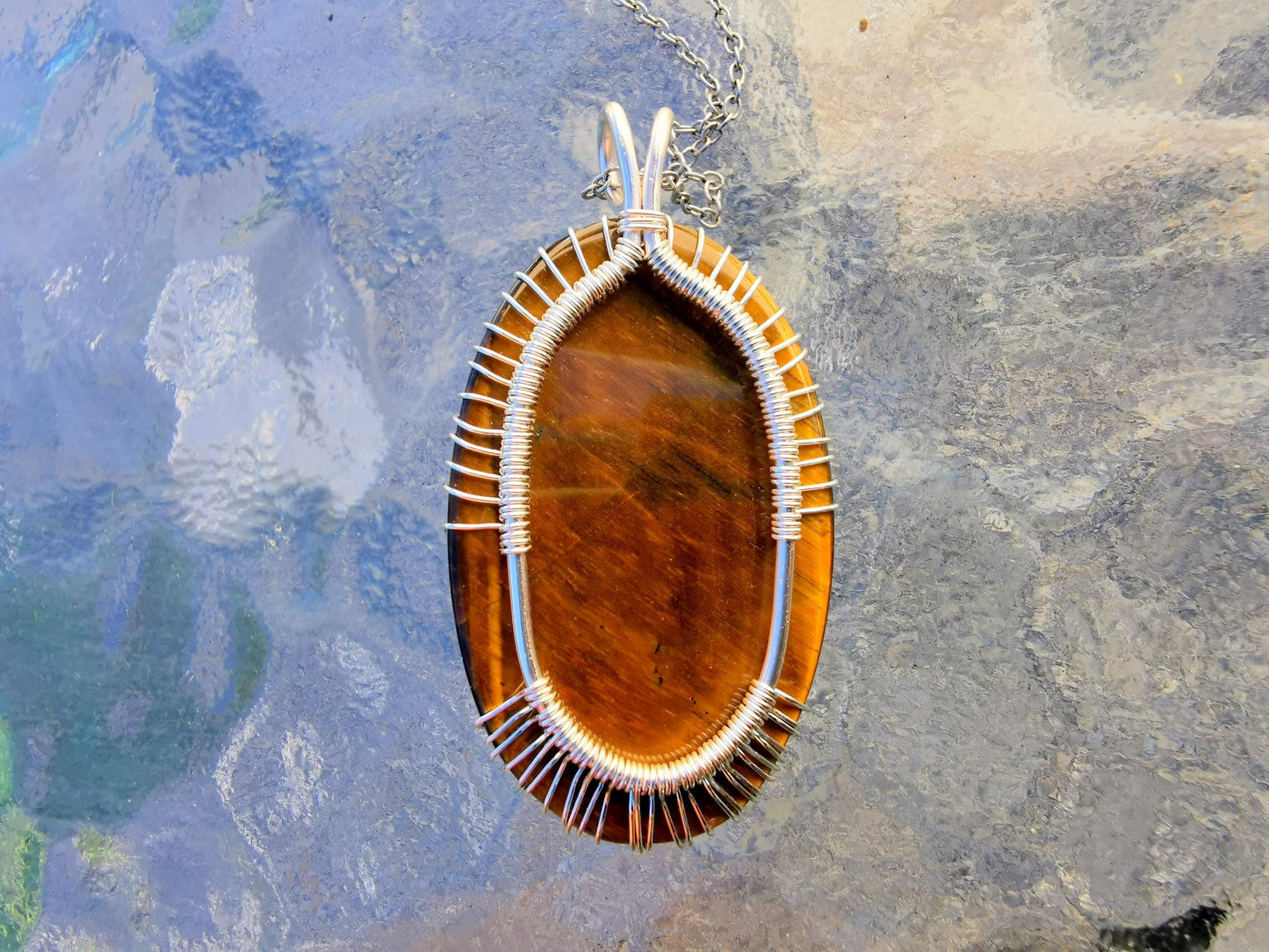 Tree pendant with a tiger's eye gemstone