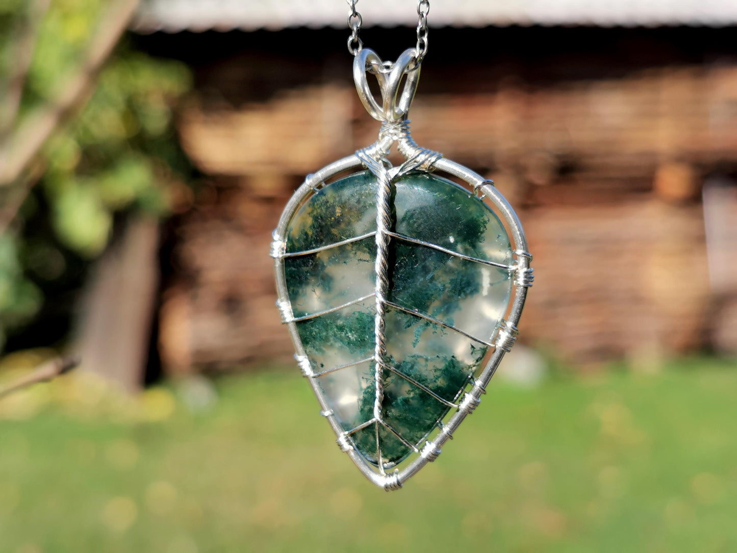 Leaf pendant with a moss agate gemstone