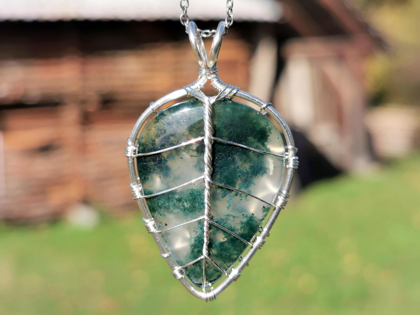 Leaf pendant with a moss agate gemstone