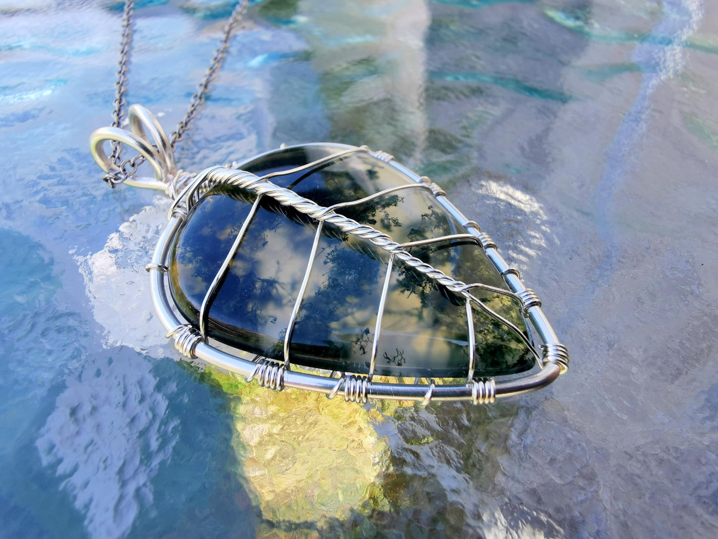 Leaf pendant with a moss agate gemstone