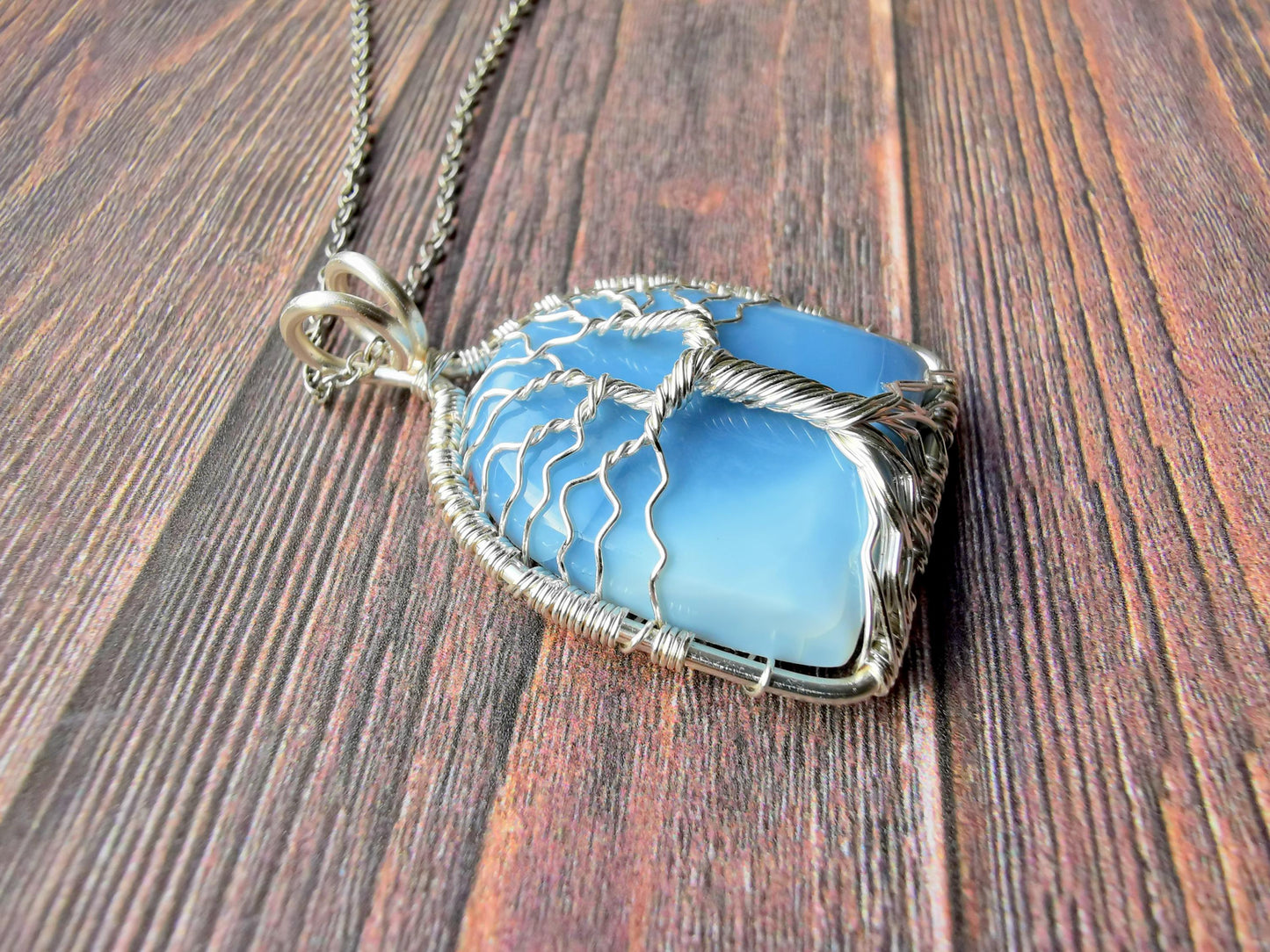 Tree pendant with a blue opal gemstone