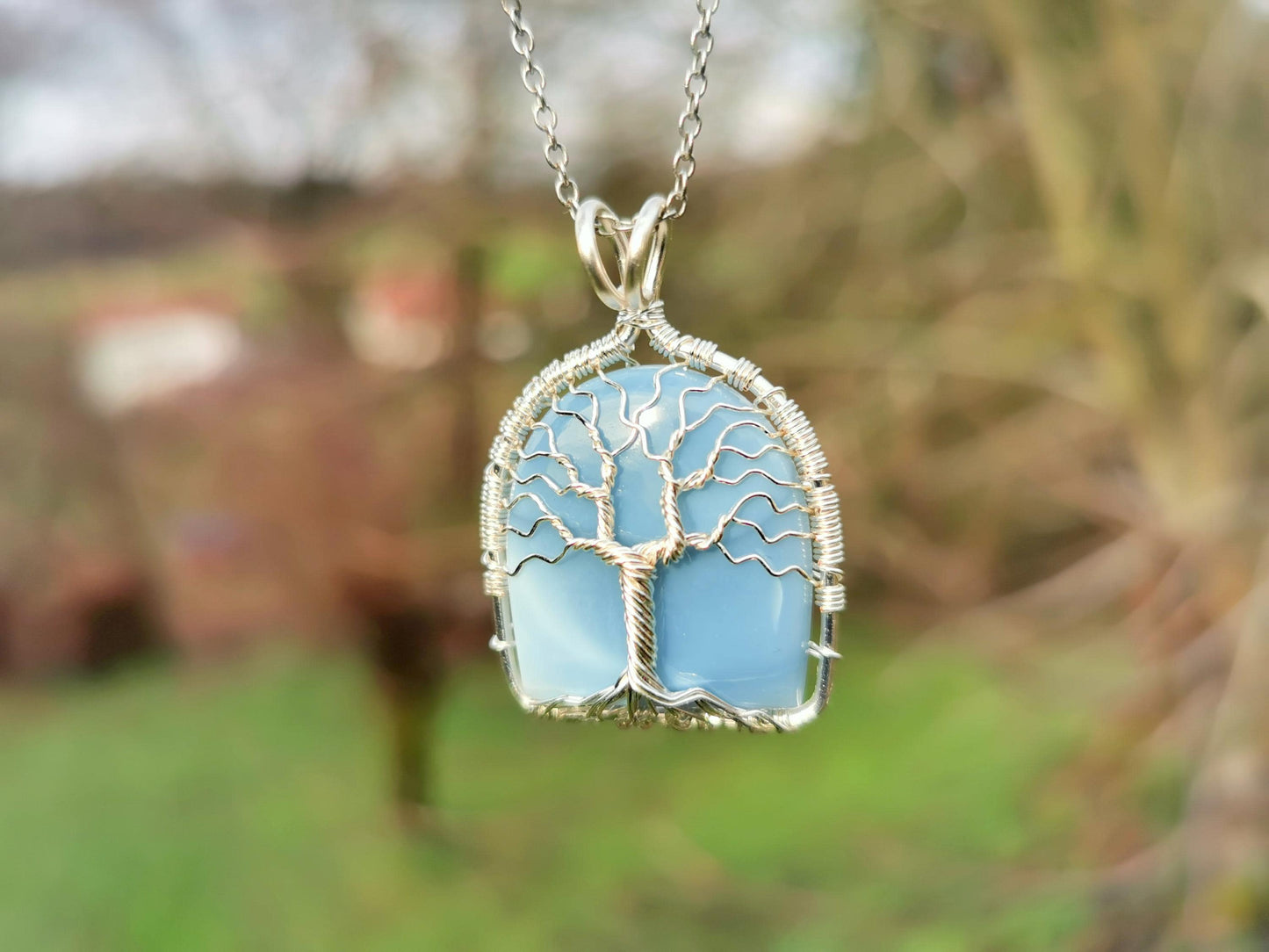 Tree pendant with a blue opal gemstone