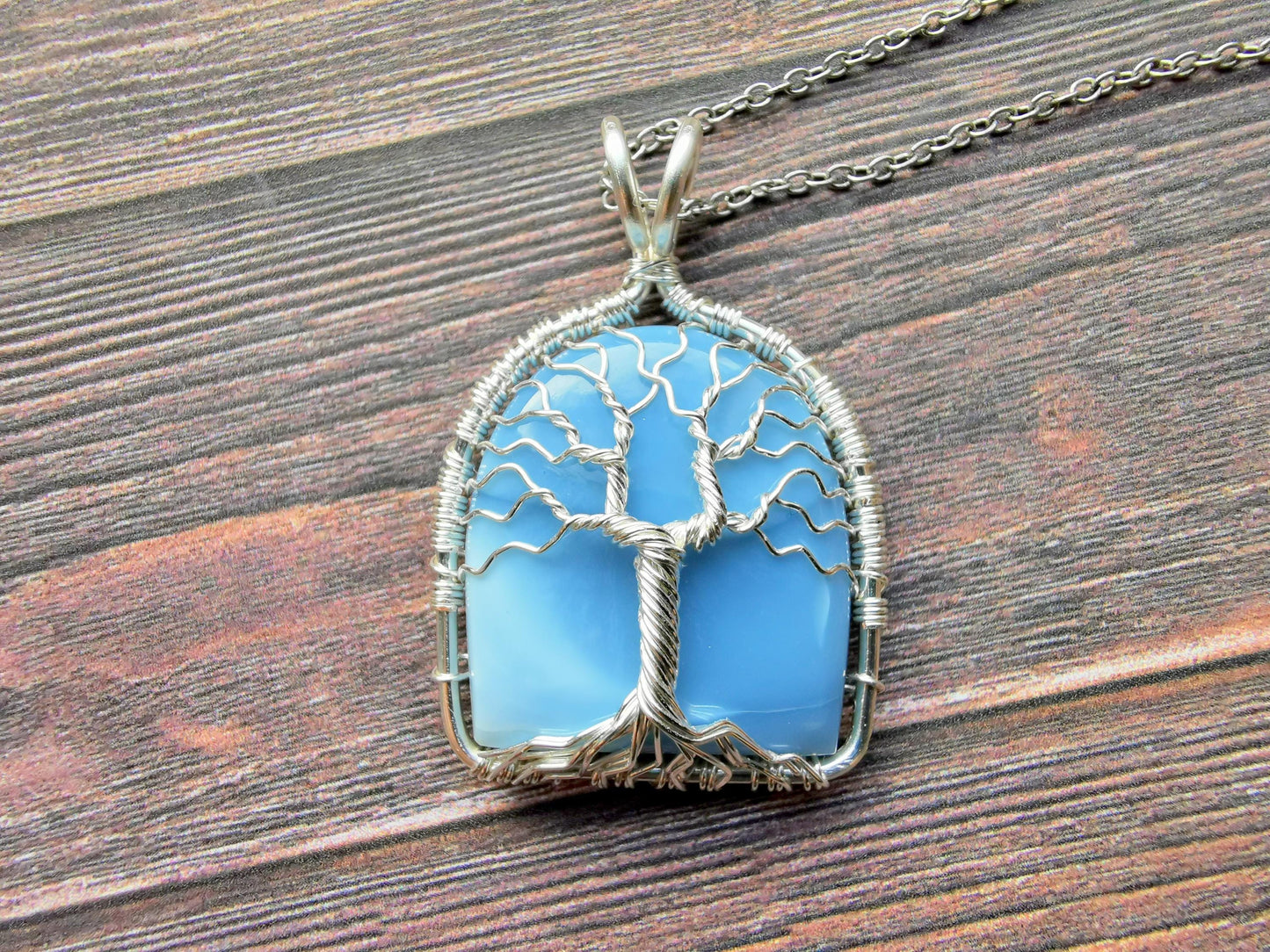 Tree pendant with a blue opal gemstone