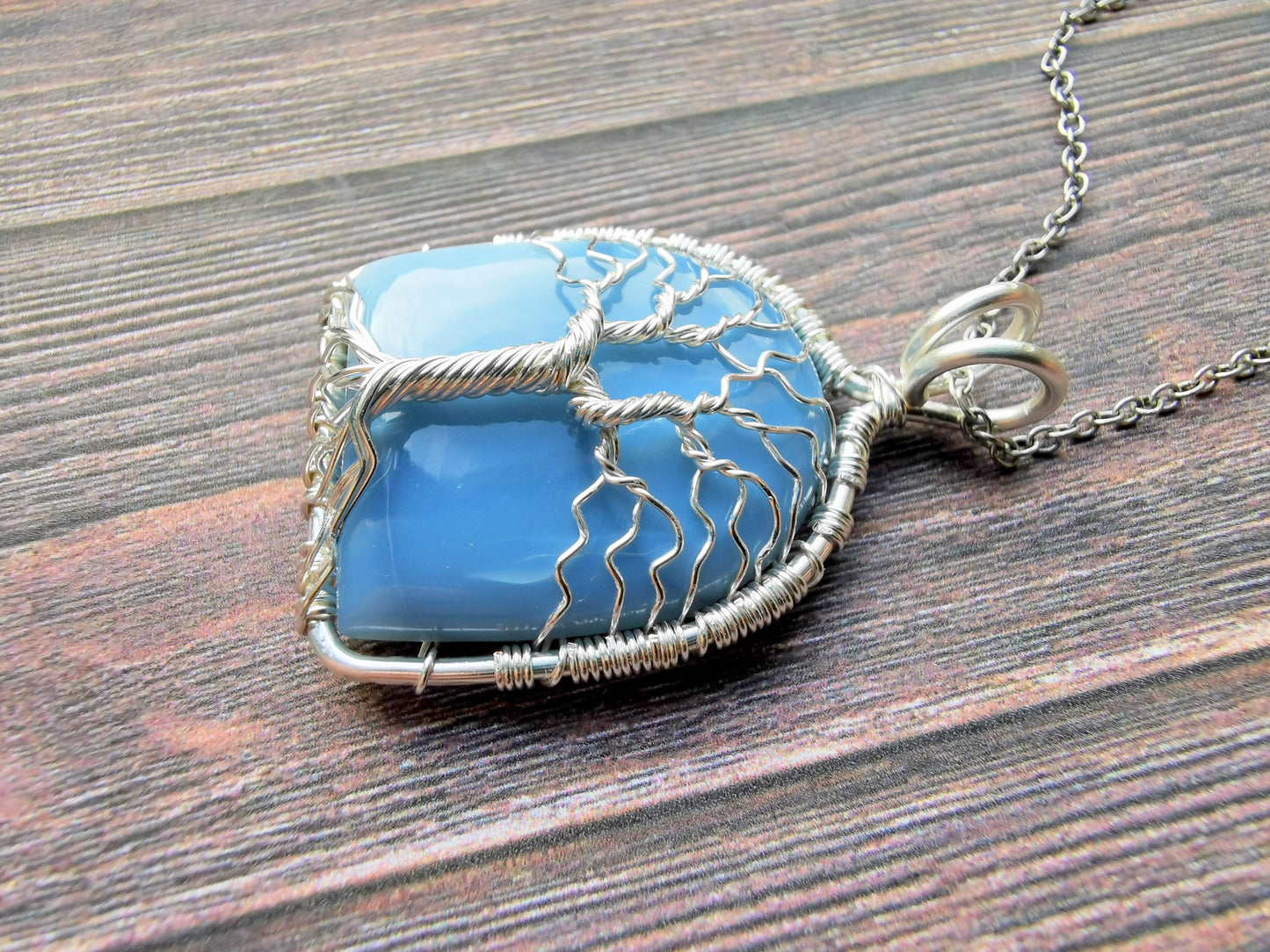 Tree pendant with a blue opal gemstone