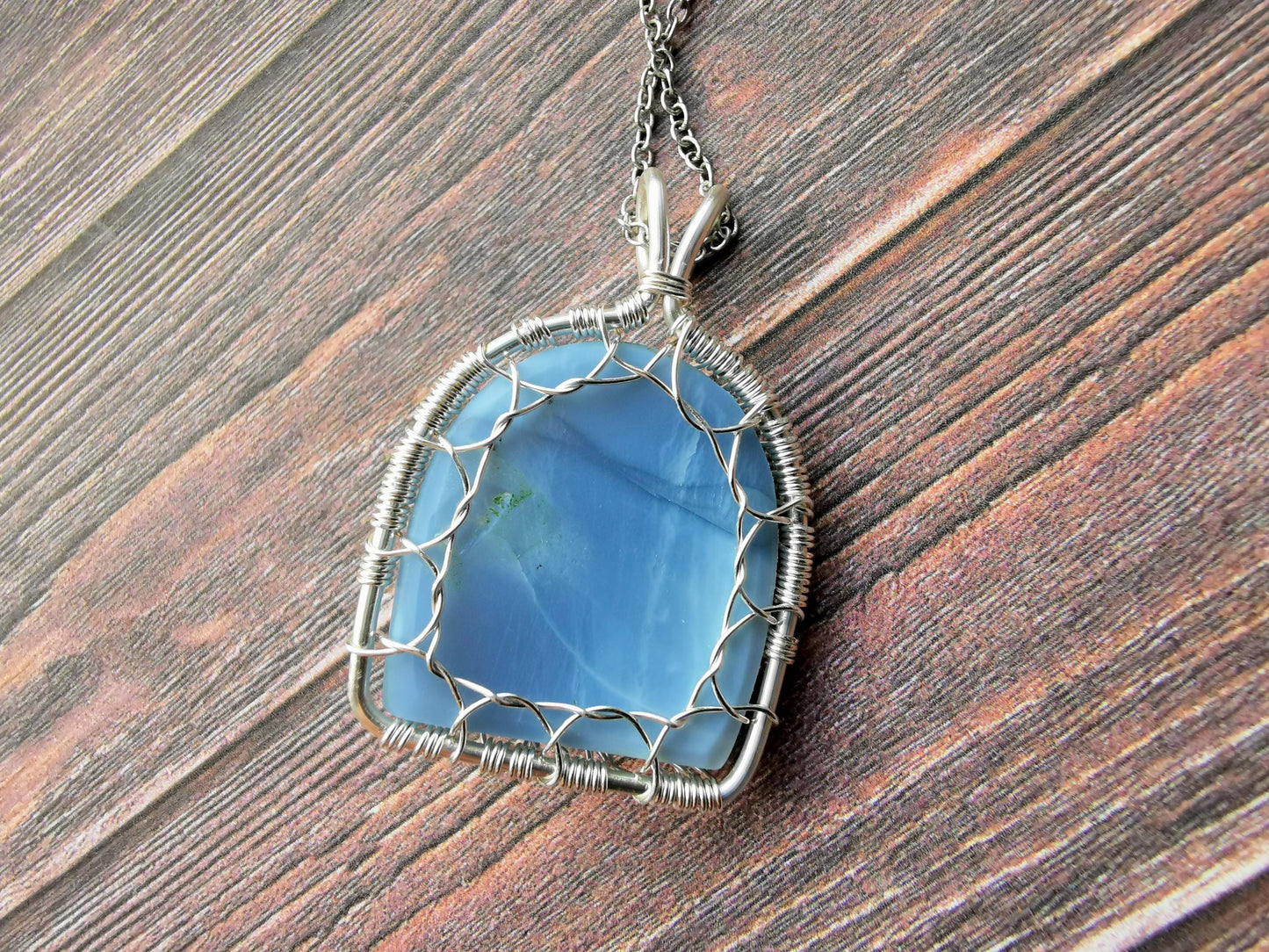 Tree pendant with a blue opal gemstone