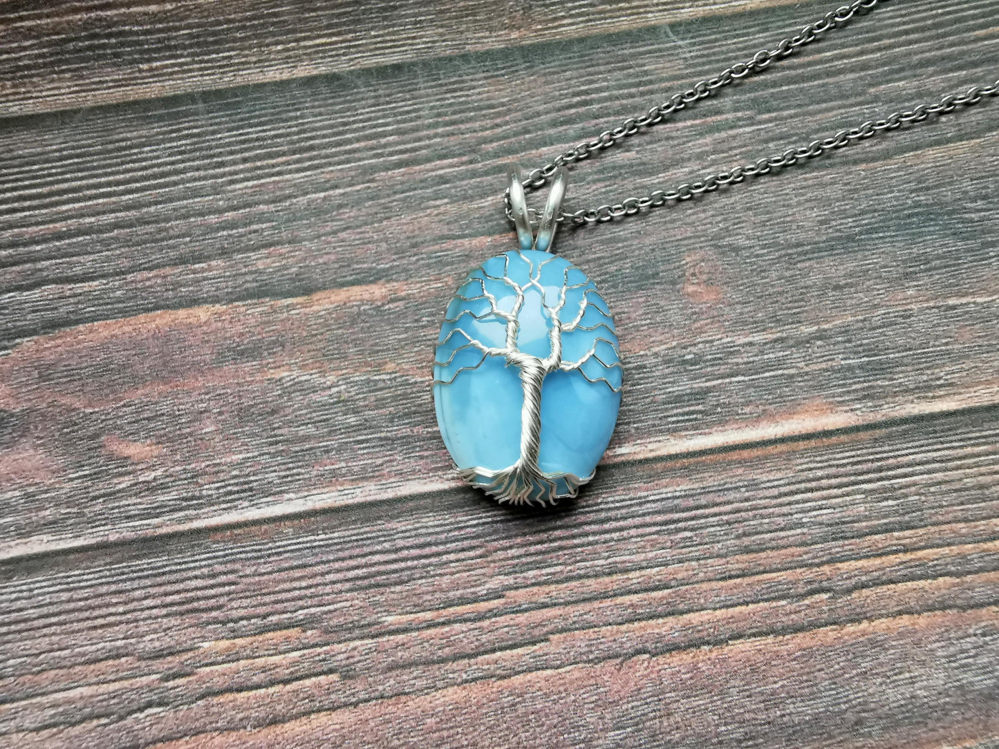 Tree pendant with a blue opal gemstone