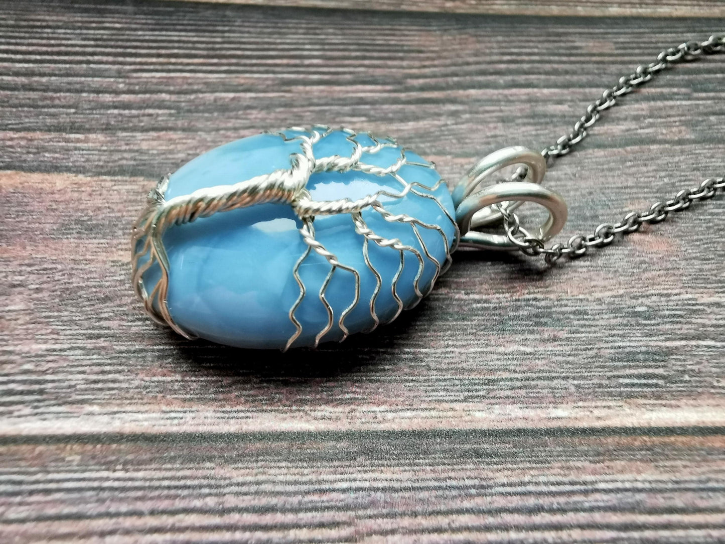 Tree pendant with a blue opal gemstone