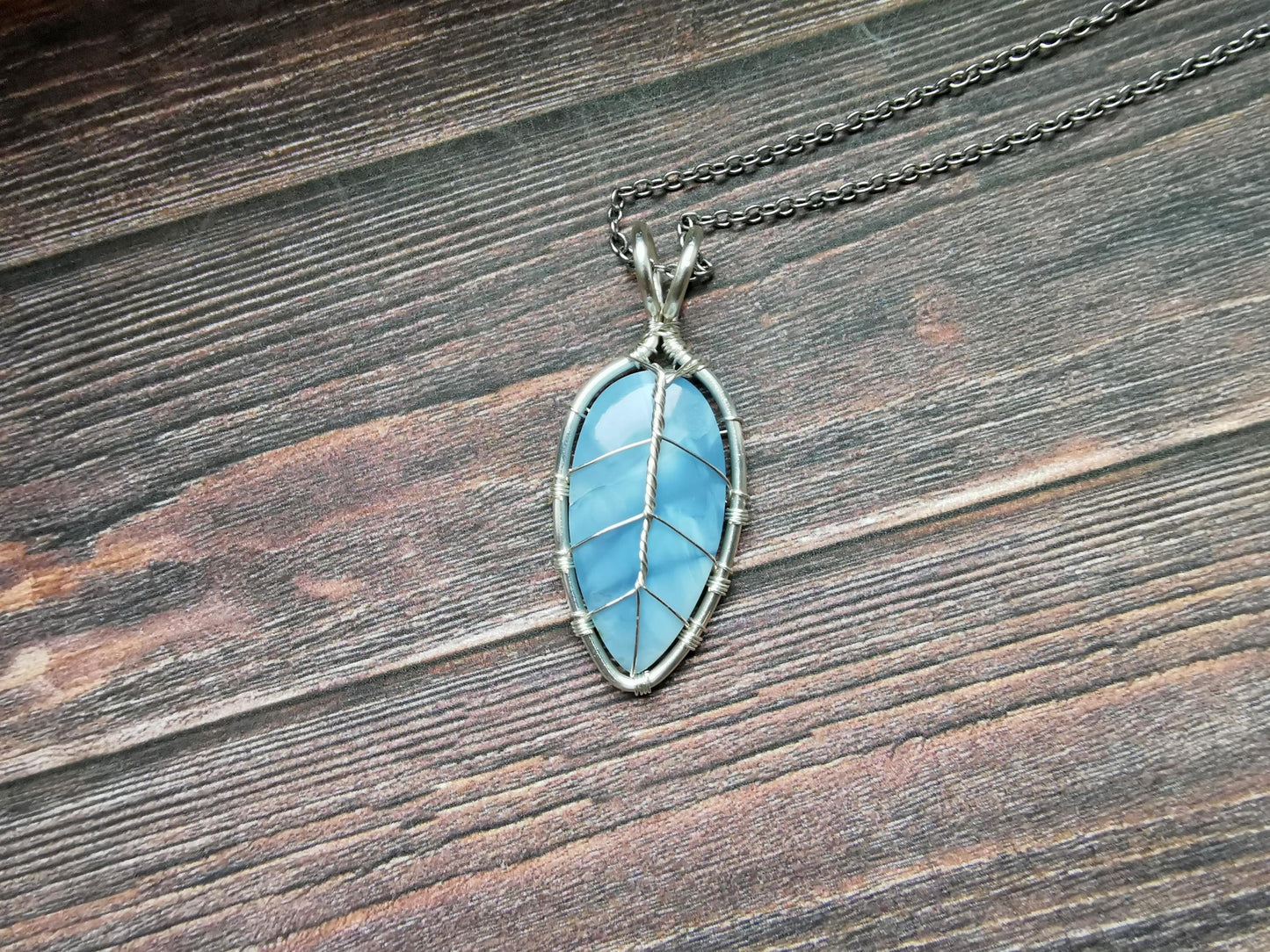 Leaf pendant with a blue opal gemstone