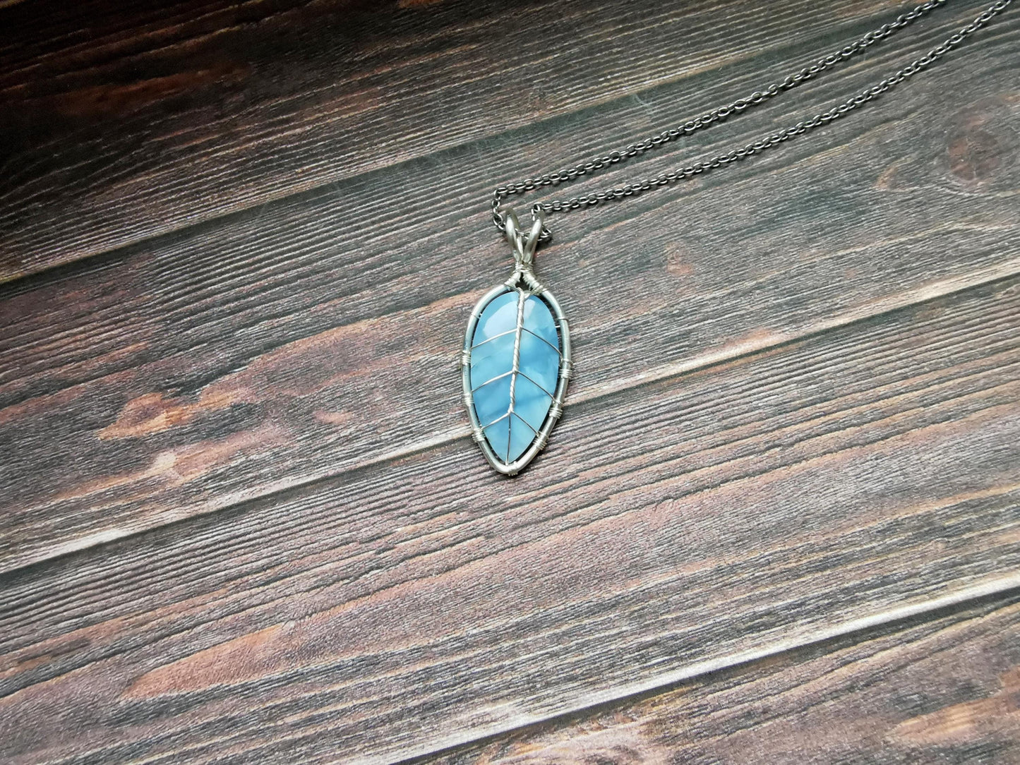 Leaf pendant with a blue opal gemstone