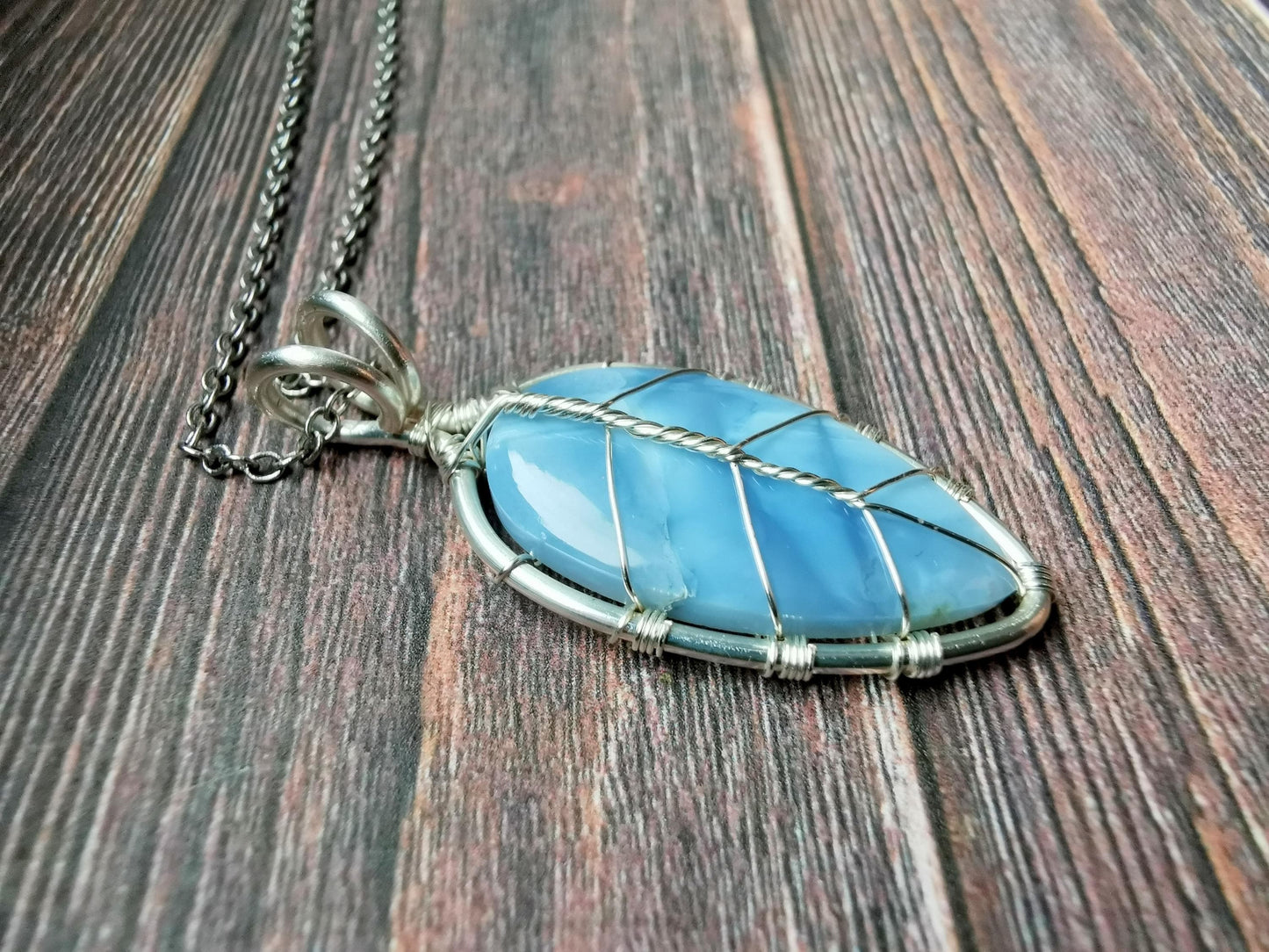 Leaf pendant with a blue opal gemstone
