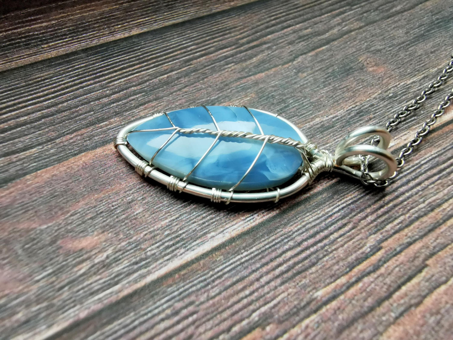 Leaf pendant with a blue opal gemstone