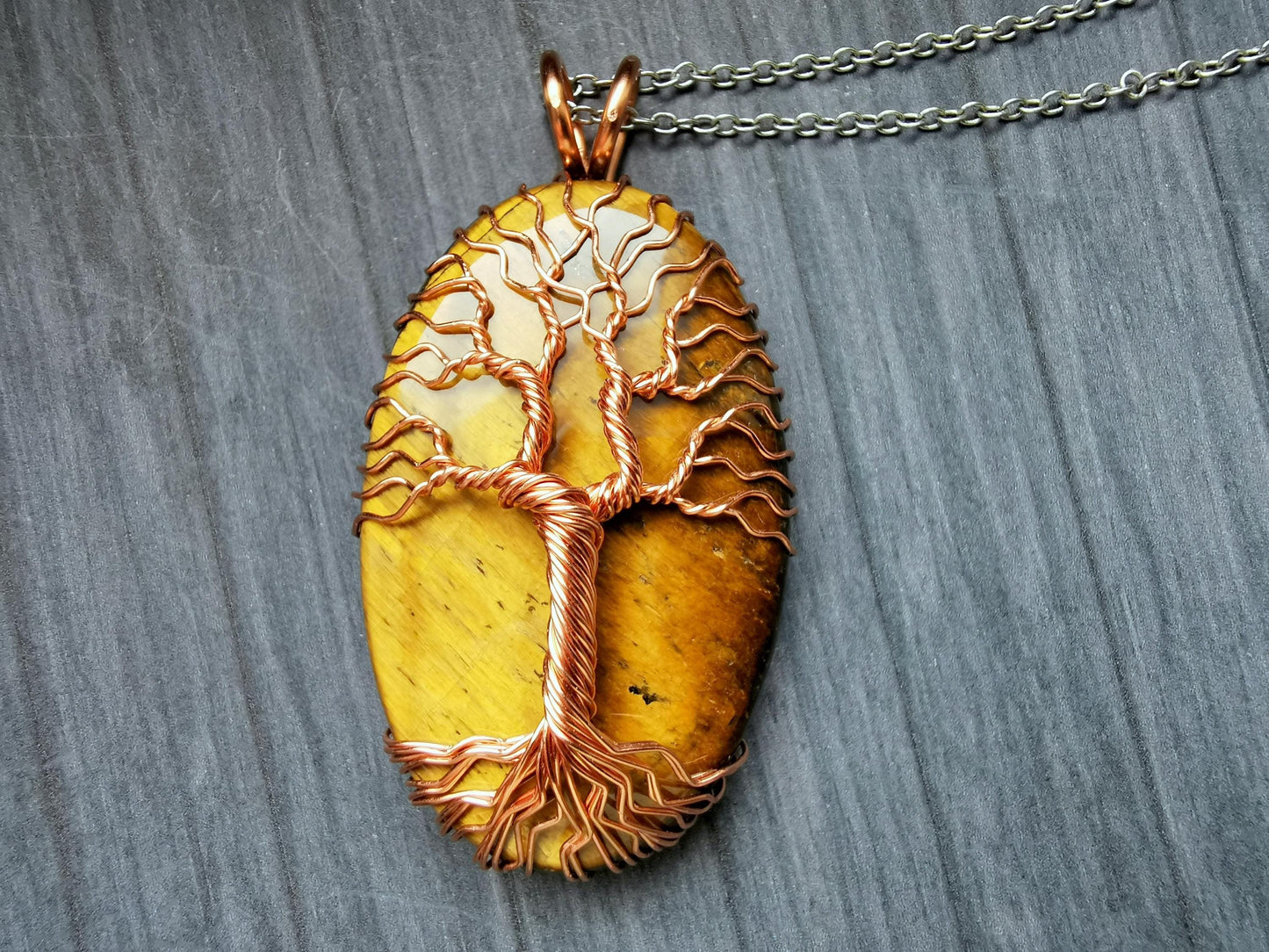 Tree pendant with a tiger's eye gemstone