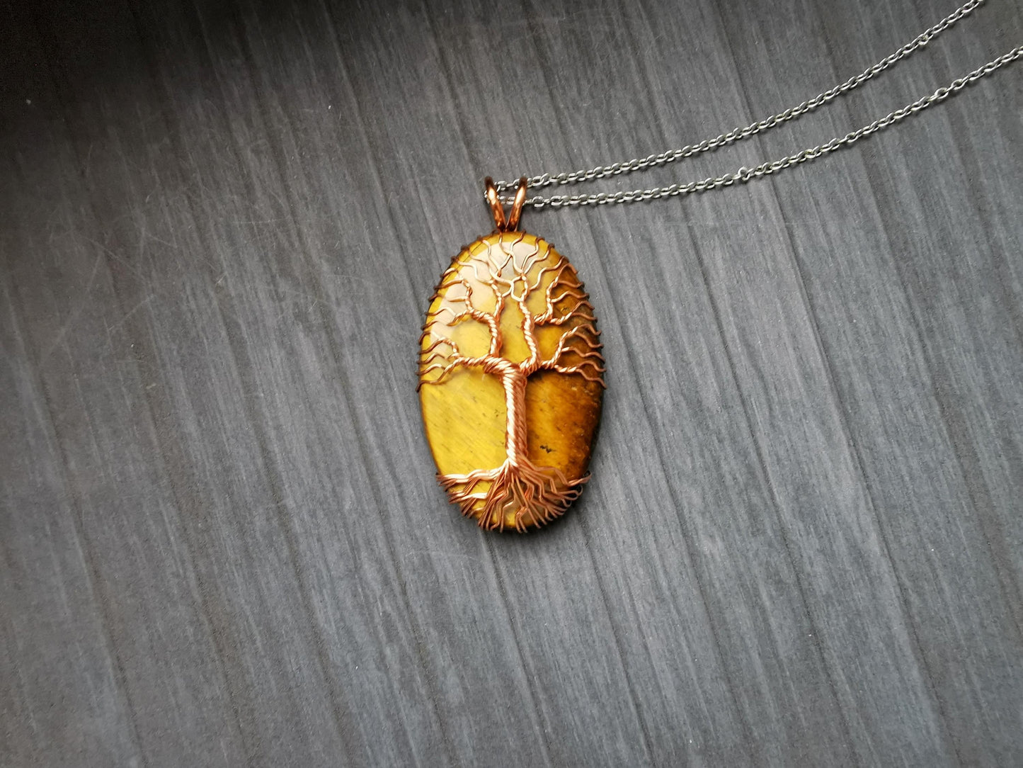 Tree pendant with a tiger's eye gemstone