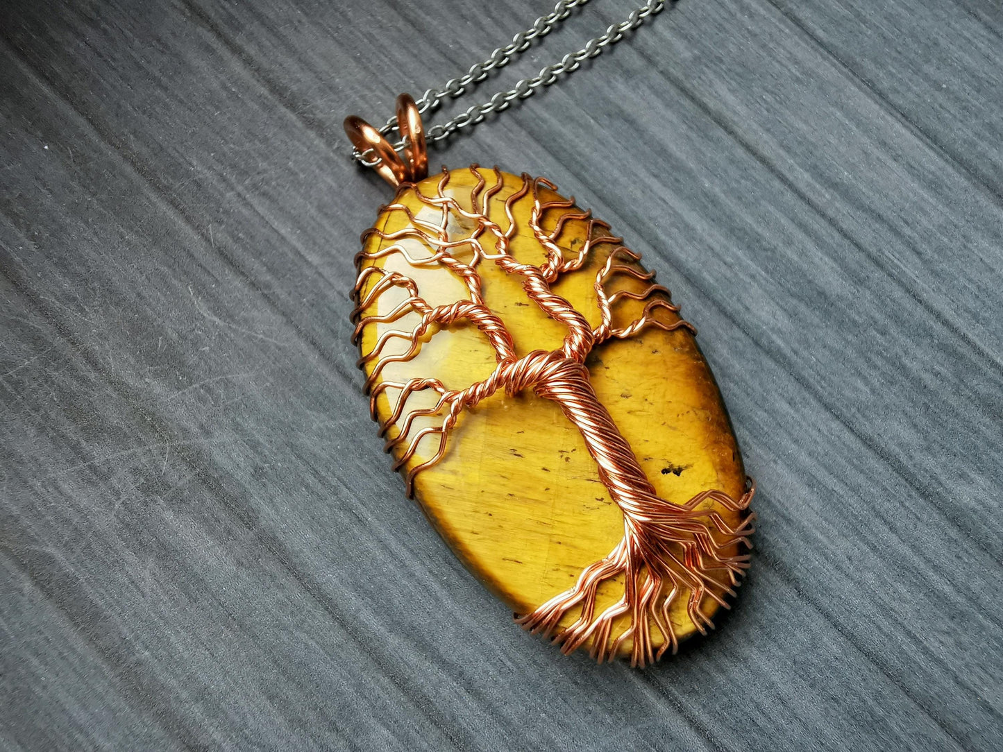 Tree pendant with a tiger's eye gemstone