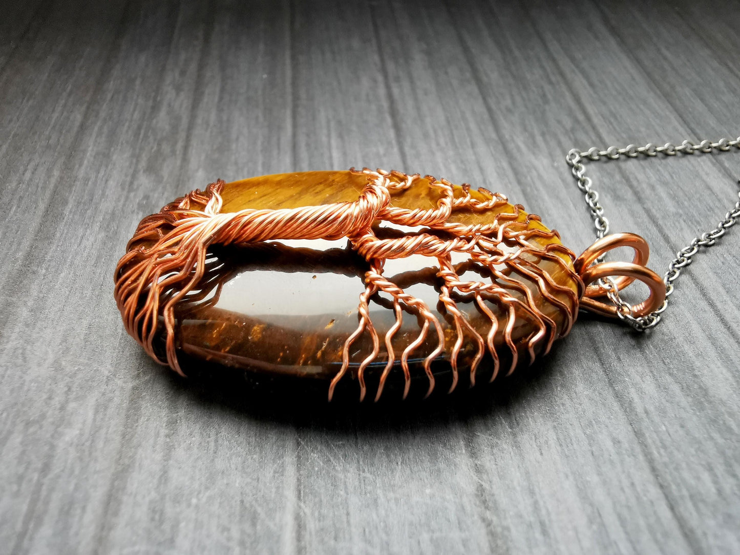 Tree pendant with a tiger's eye gemstone