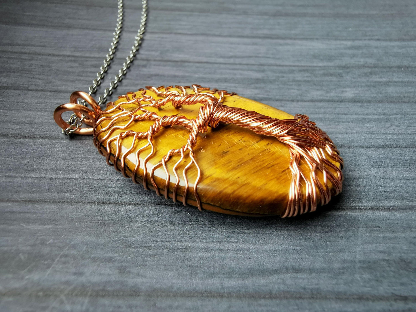 Tree pendant with a tiger's eye gemstone