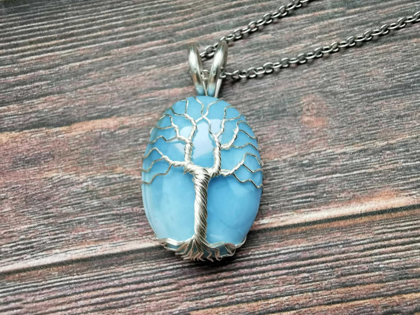 Tree pendant with a blue opal gemstone